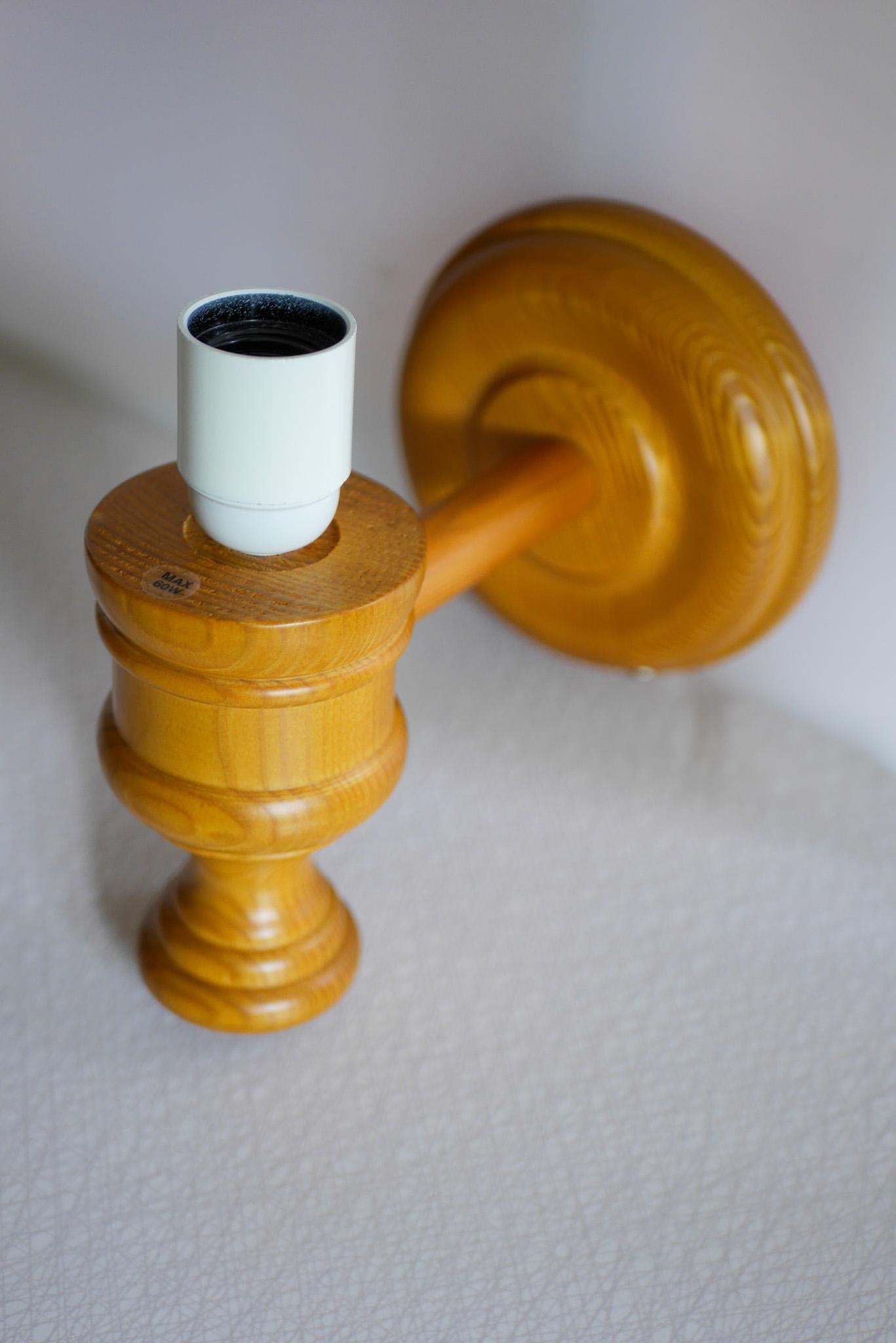 Pine Swedish wooden sconce and rattan shade, a Wall Lamp by Smålandsslöjd Sweden For Sale
