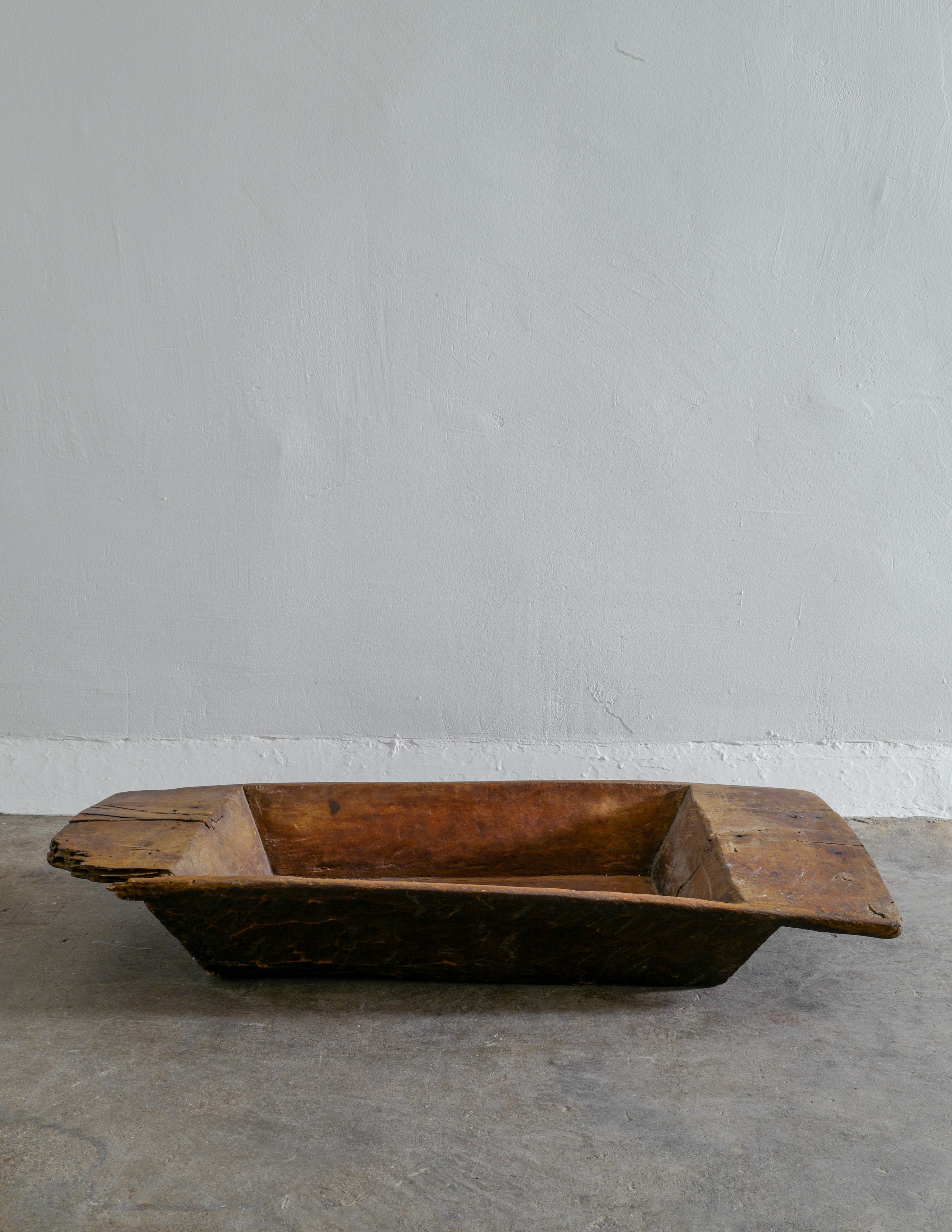Rare and oversized wooden tray in a Brutalist and wabi sabi style produced in Sweden. In good vintage condition showing heavy patina from use and age. Nice dark brown color.