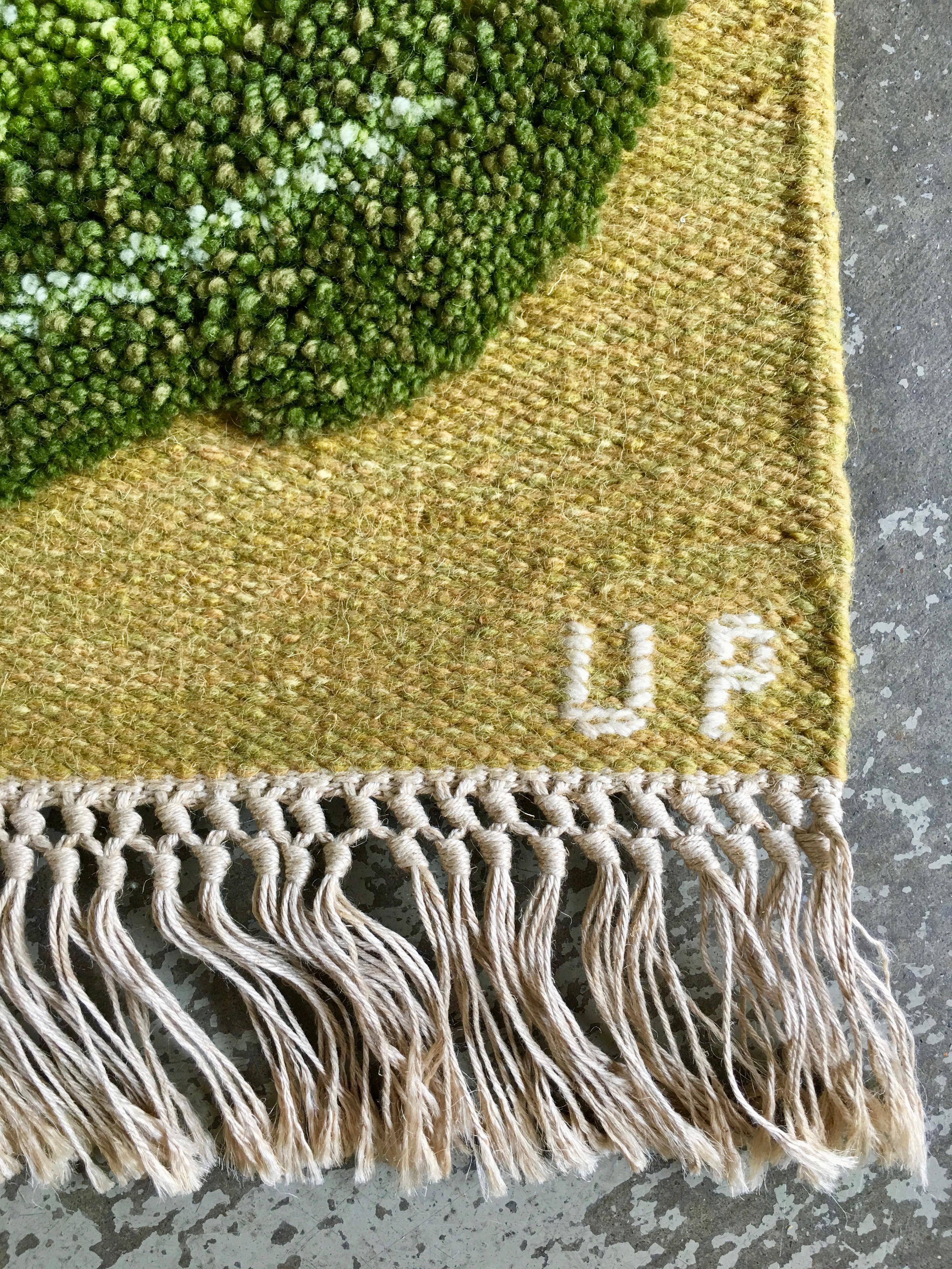 Classic composition of wildflower Dandelions and foliage. Composed on a flat-weave base with tufted detail. Complete with hanging bar in vintage condition with minor wear.