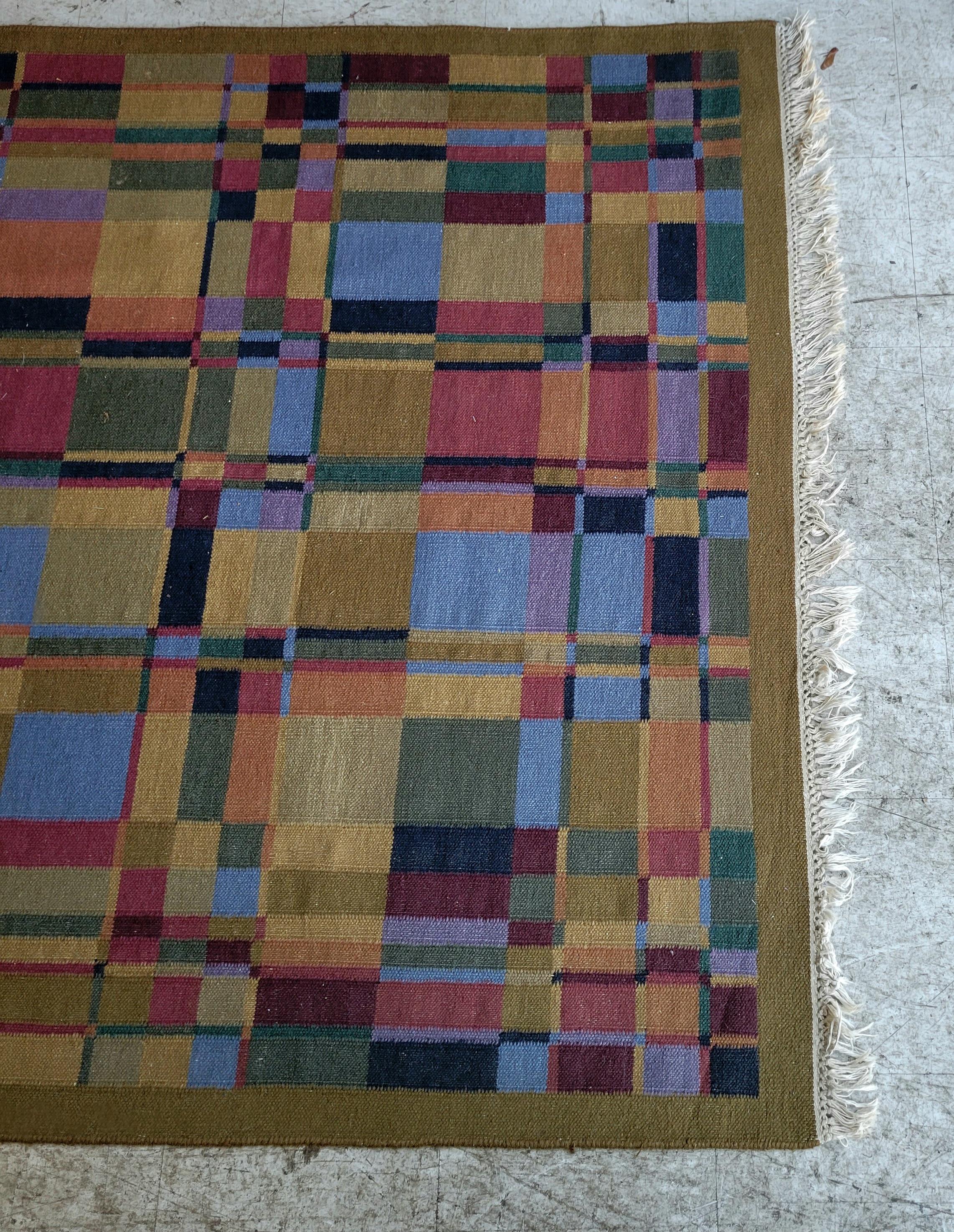 Beautifully woven and constructed wool rug from Sweden circa the Mid-1960s. Woven in a great use of earthy tones, this rug will lend its self to creating a harmonious and neutral tone to any space.