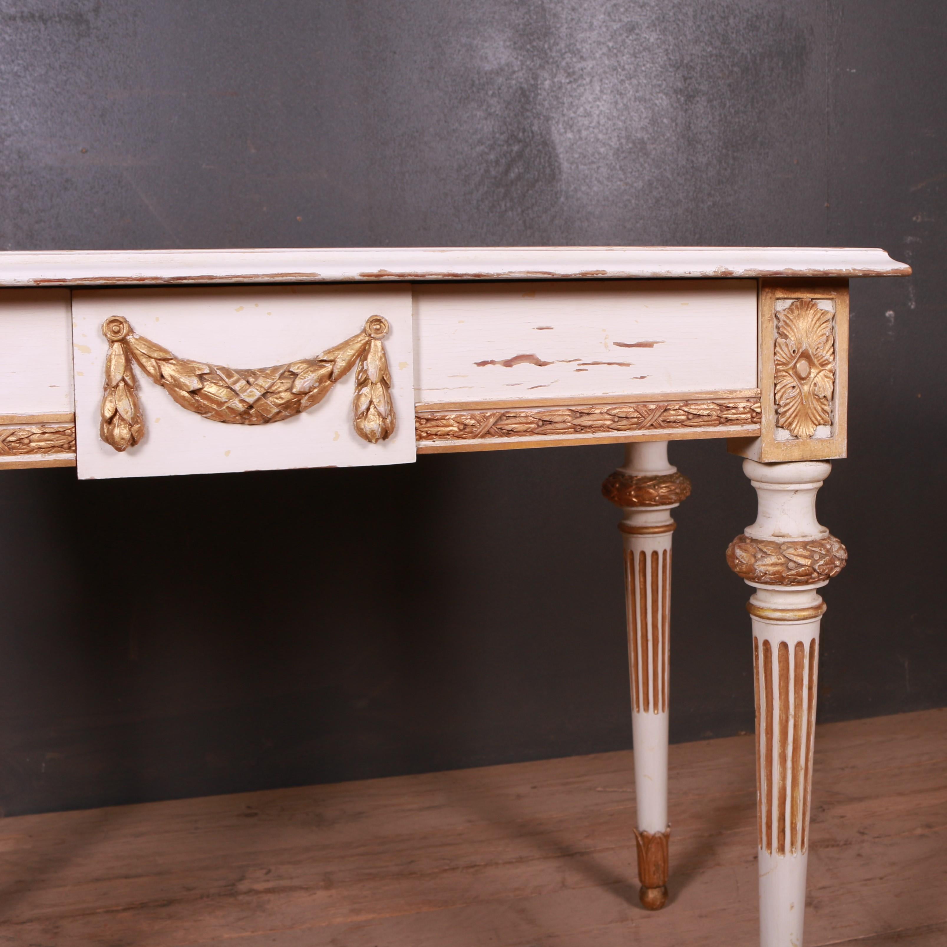 Original painted Swedish 3 drawer writing table. Nicely decorated with fluted legs and swag carving. Carved on all sides so can be a free standing table, 1900.

  

Dimensions
38.5 inches (98 cms) wide
21 inches (53 cms) deep
29 inches (74