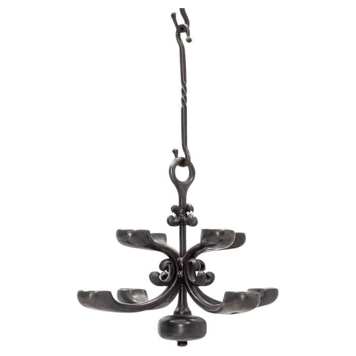Beautiful Hanging Wrought Iron Swedish Chandelier mid-20th century.
Two tiers of candles, for a total of eight candles.
The Chandelier is 31 cm high but it also includes four extension hooks (each hook measuring 22.5 cm)for a high total of 121 cm.