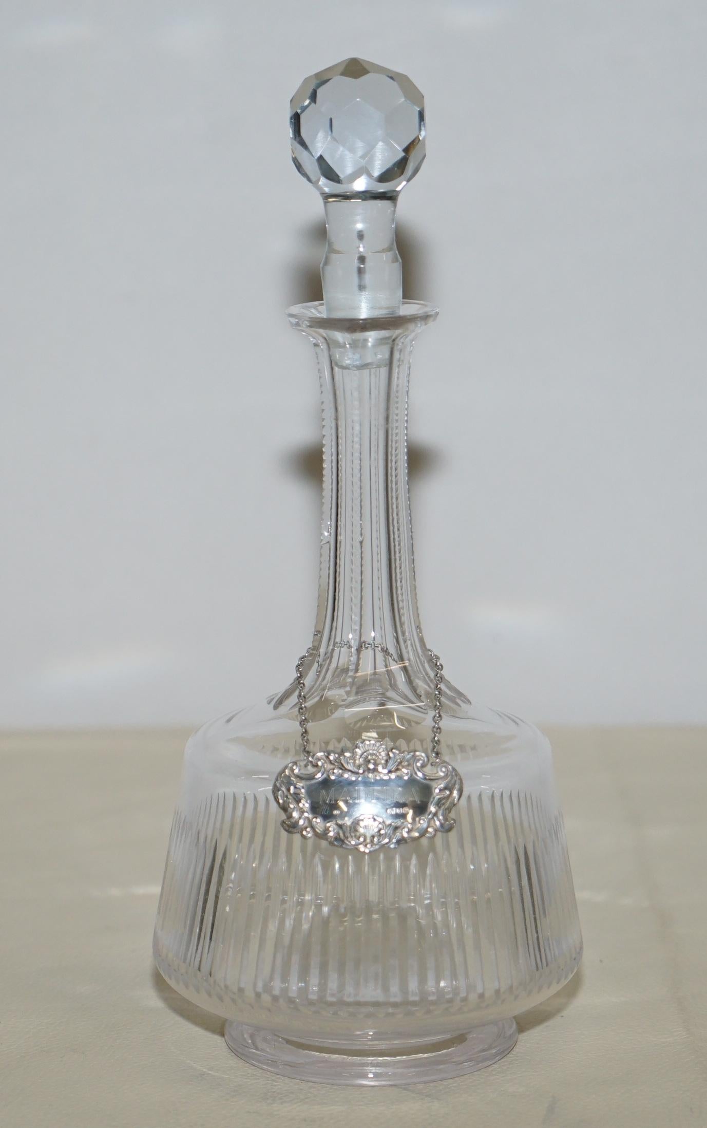 We are delighted to offer for sale sublime cut glass crystal decanter with sterling silver Maderia hanging label

A good looking and decorative piece, the hanging collar is clearly hallmarked with the sideways facing Lion for 925 sterling silver,