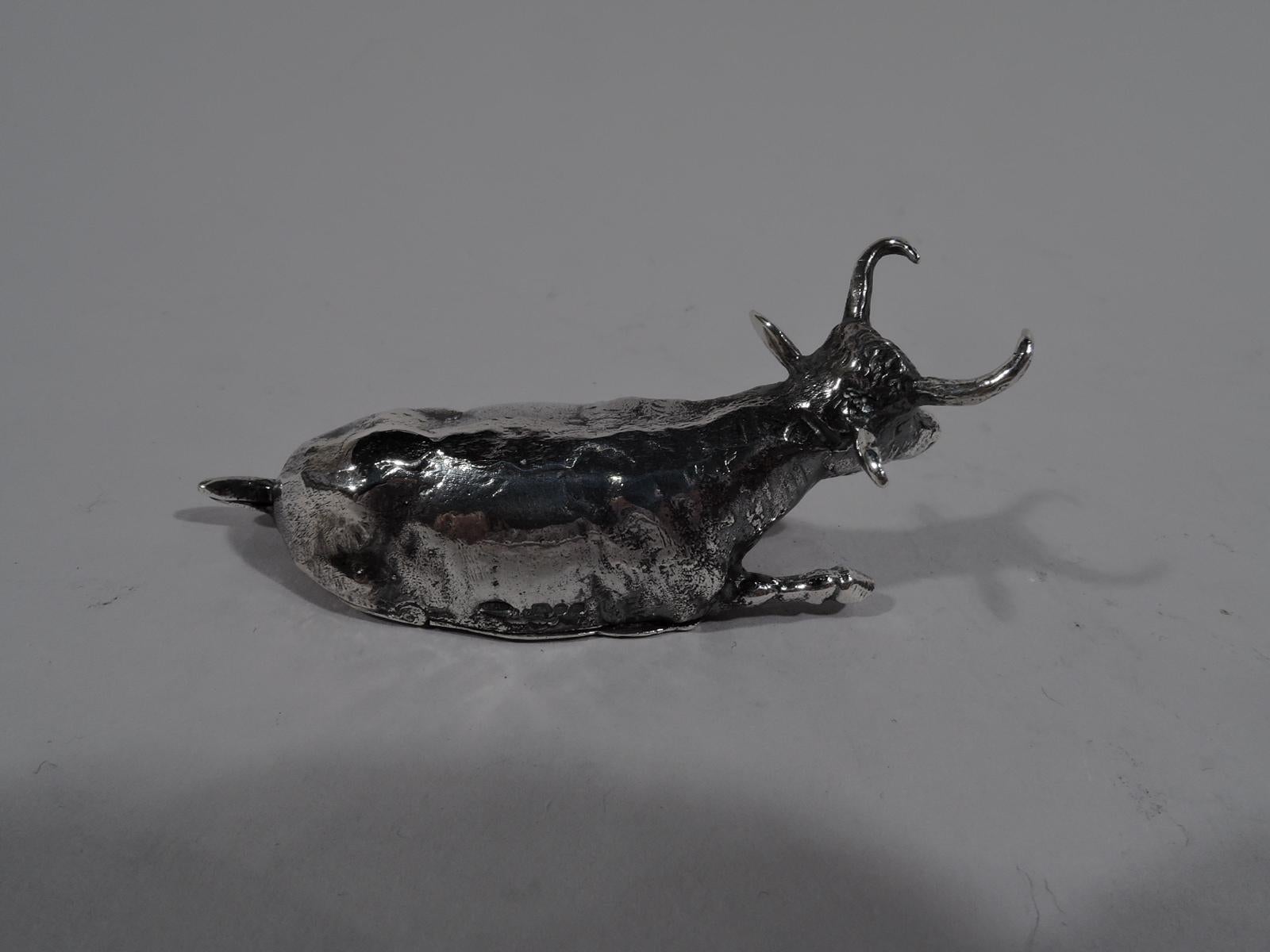 Sweet English sterling silver cast figural pillbox, 1980. A recumbent cow with outstretched forepaw. Horns sharp and haunches nicely delineated. Underside hinged. Fully marked including London assay stamp and maker’s stamp BAC.