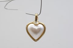 Sweet heart pearl pendant in gold with diamond