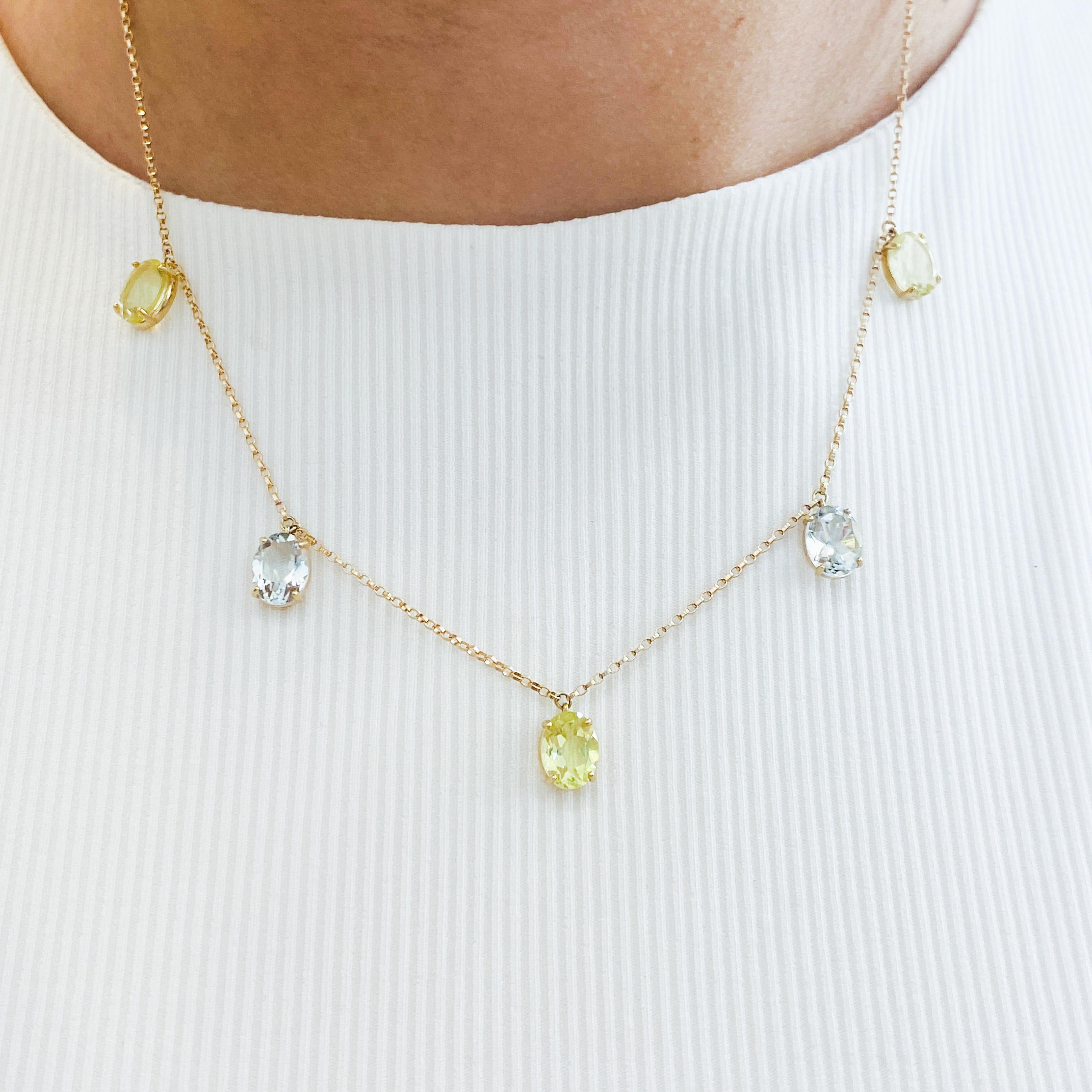 Add this refreshingly light and bright quartz necklace to your jewelry collection! The colors of these quartz ovals bring to mind refreshing beverages brightly accented with lemon and mint! The yellow gold of the chain and settings add a warmth like