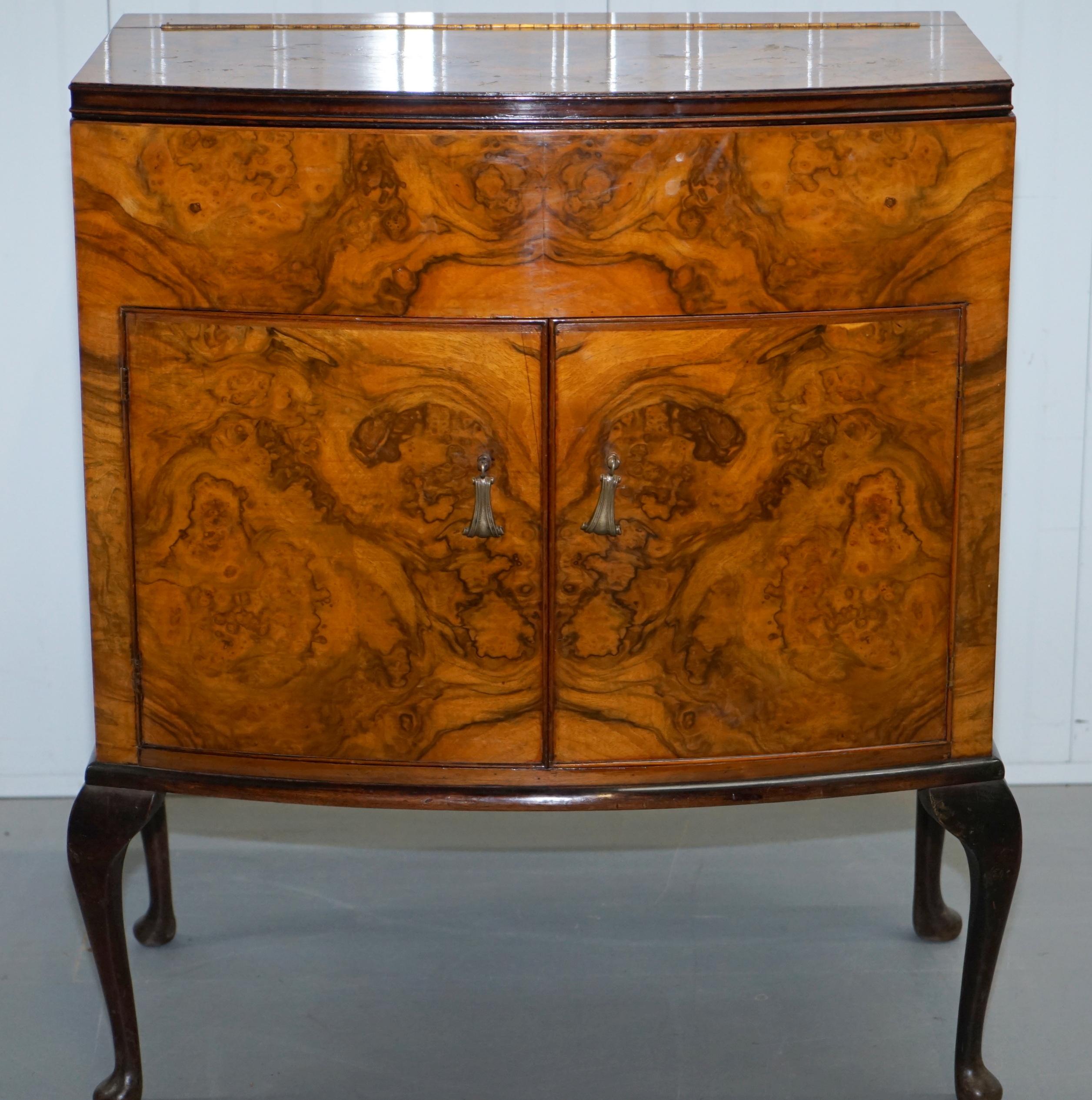 We are delighted to offer for sale this lovely little Burr Walnut drinks cabinet with mirrored door.

A very good looking and well-made piece, the burr walnut is box cut and in nice order, as you can see you have a large open top section for