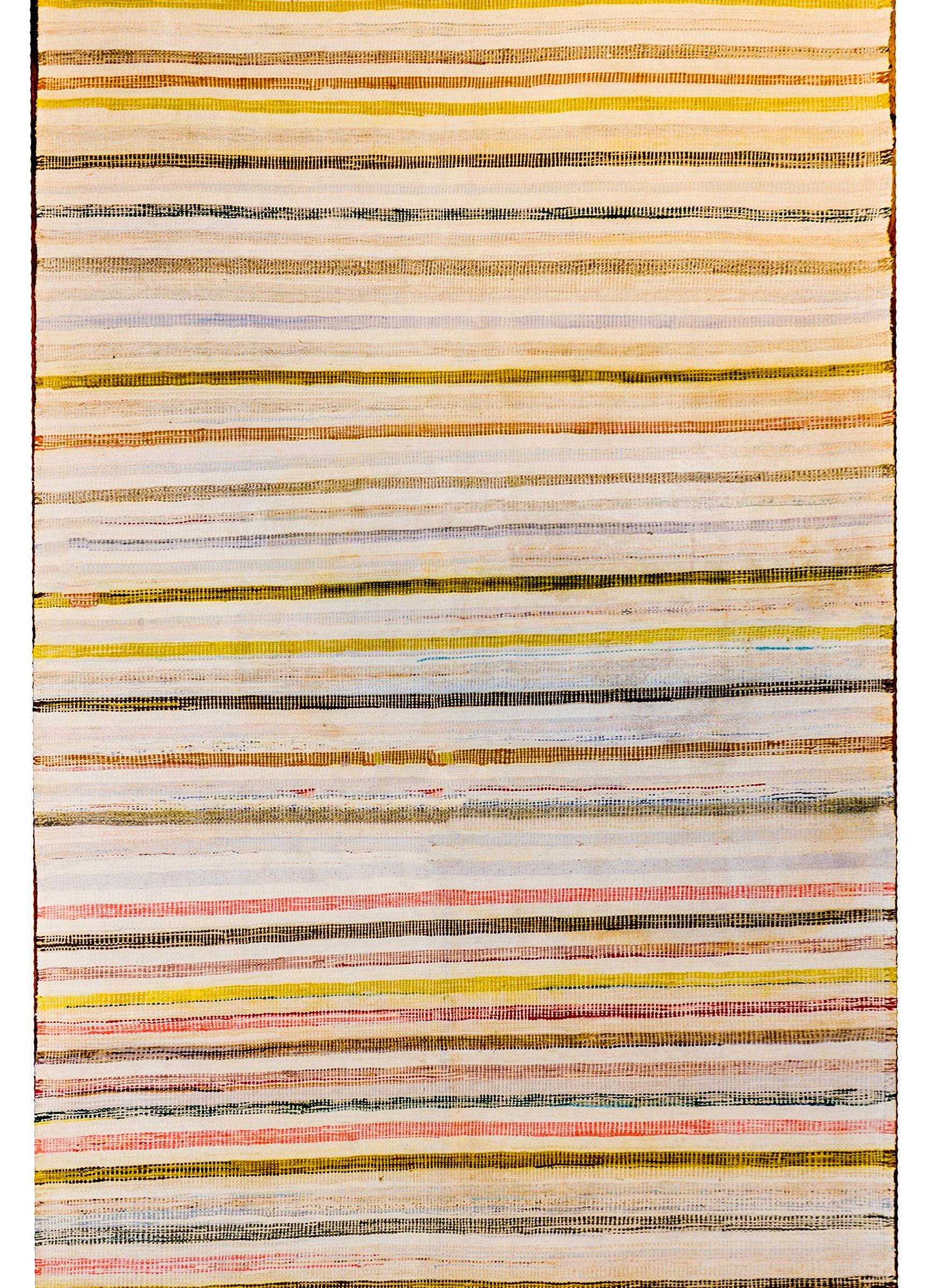 A sweet mid-20th century Persian Saveh Kilim rug woven with varying colored cotton stripes running horizontally across the field.