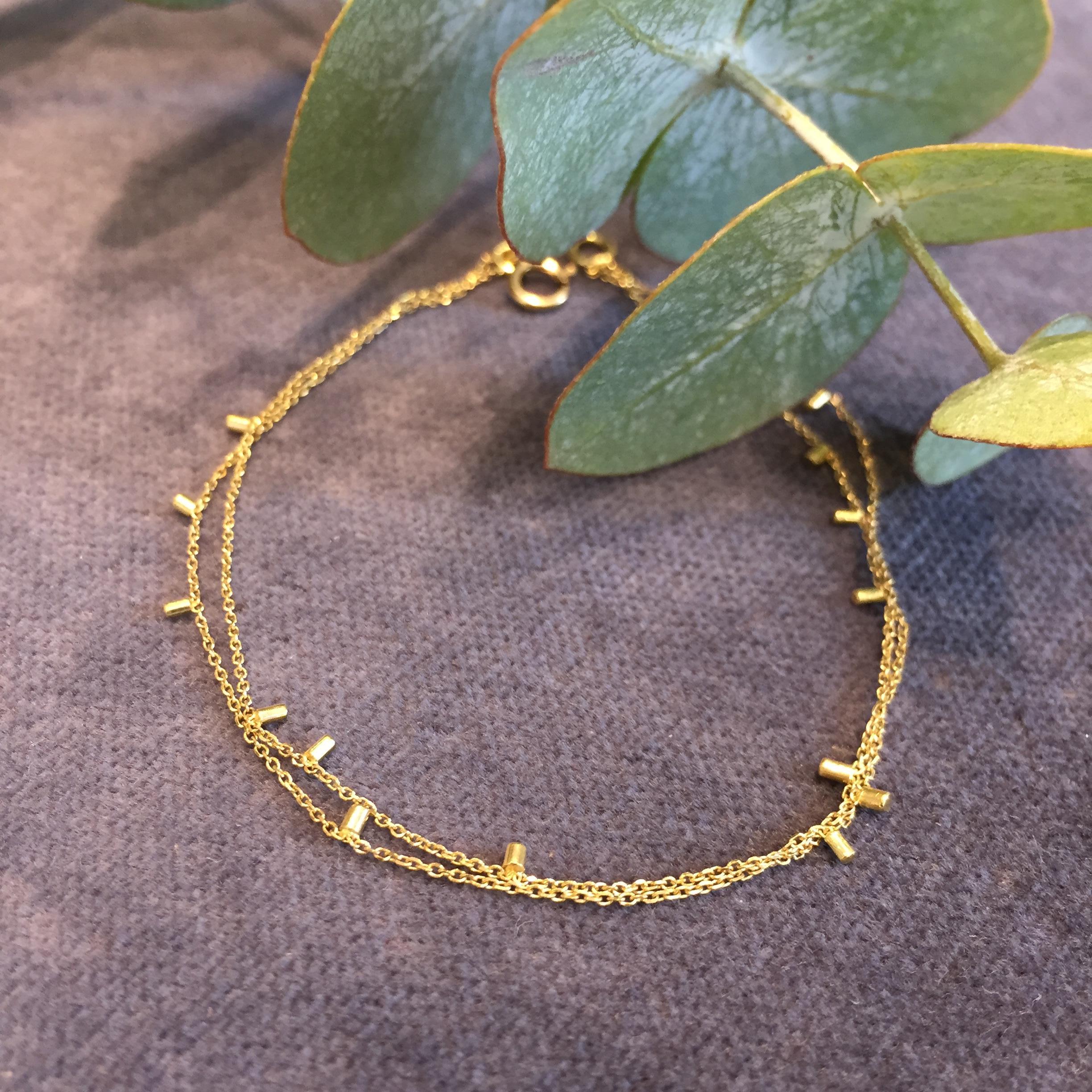 This 18k yellow gold fine double strand bracelet is a classic from Sweet Pea's most popular collection; Gold Dust. This bracelet is 16.5cm long but can be ordered in any required length. Made from delicate, fine, diamond cut chain which sparkles and