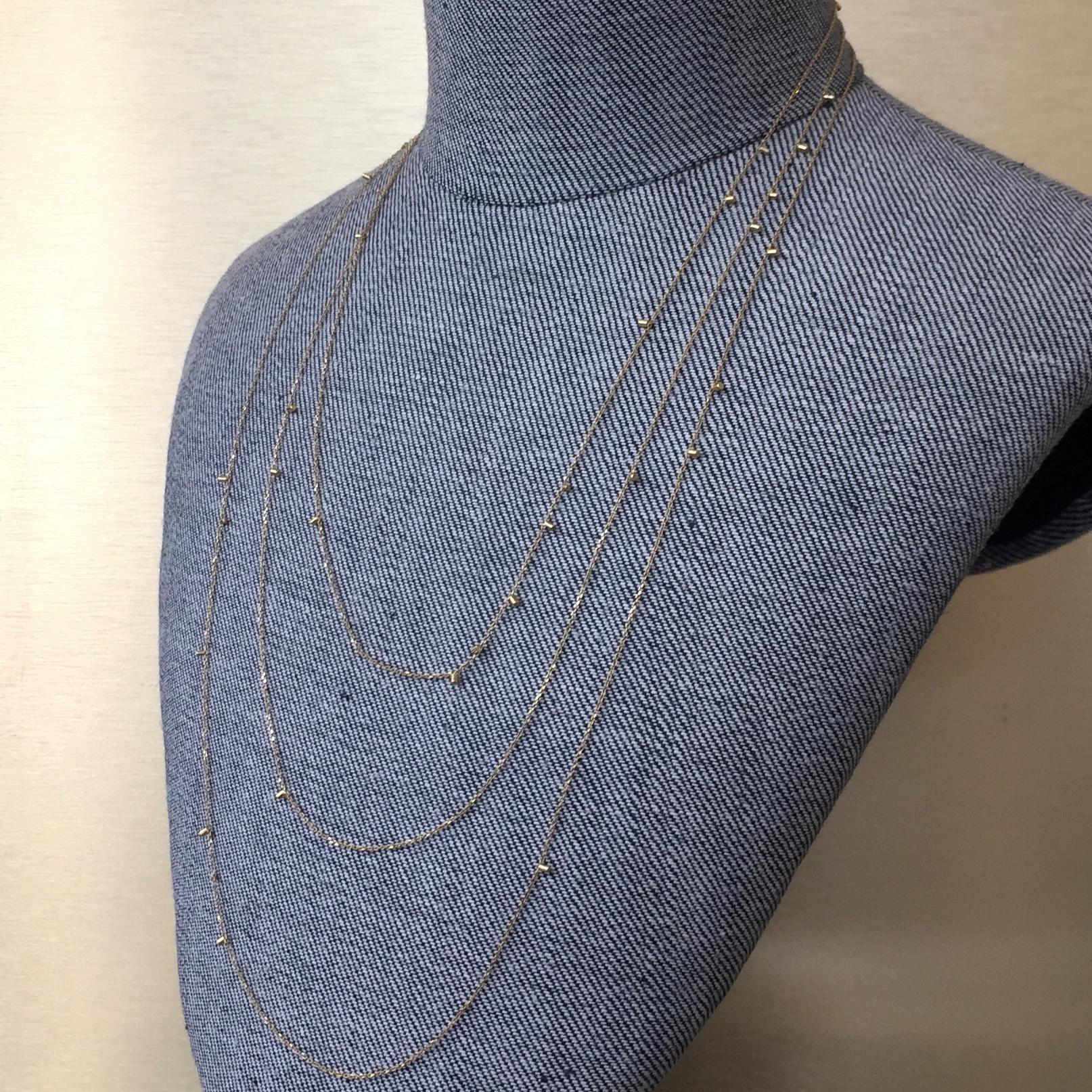 This 18k yellow gold fine long chain necklace is a classic from Sweet Pea's most popular collection; Gold Dust. This necklace is 140cm long but can be ordered in any required length. Please note the image shows the necklace as though it was being