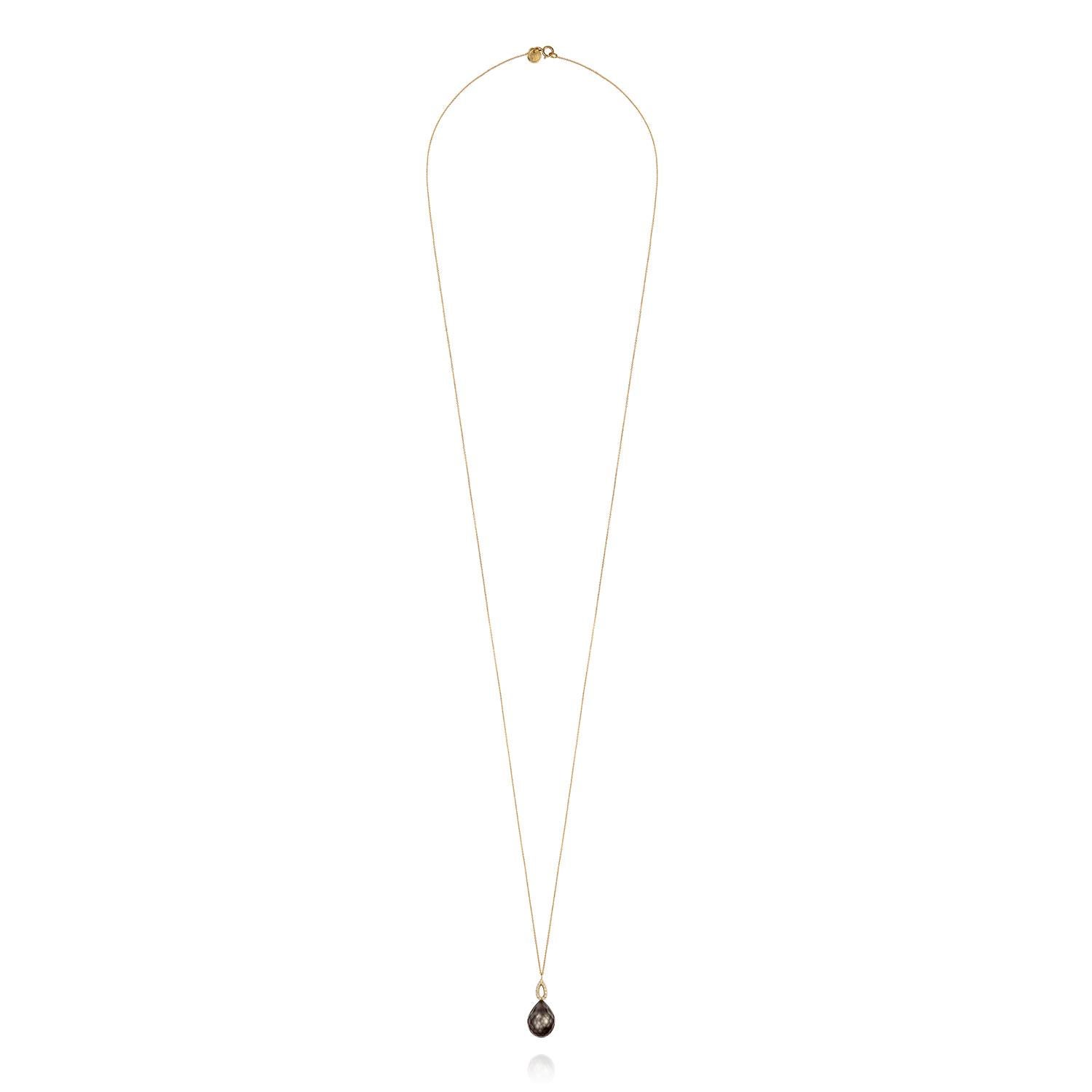 An 18k yellow gold fine 82cm long chain with dark grey faceted Tahitian pearl drop with a diamond studded marquise shaped bale. The pearl measures 10mm x 13mm and the total diamond weight is 0.07ct. Wear this one-off necklace from Sweet Pea alone,