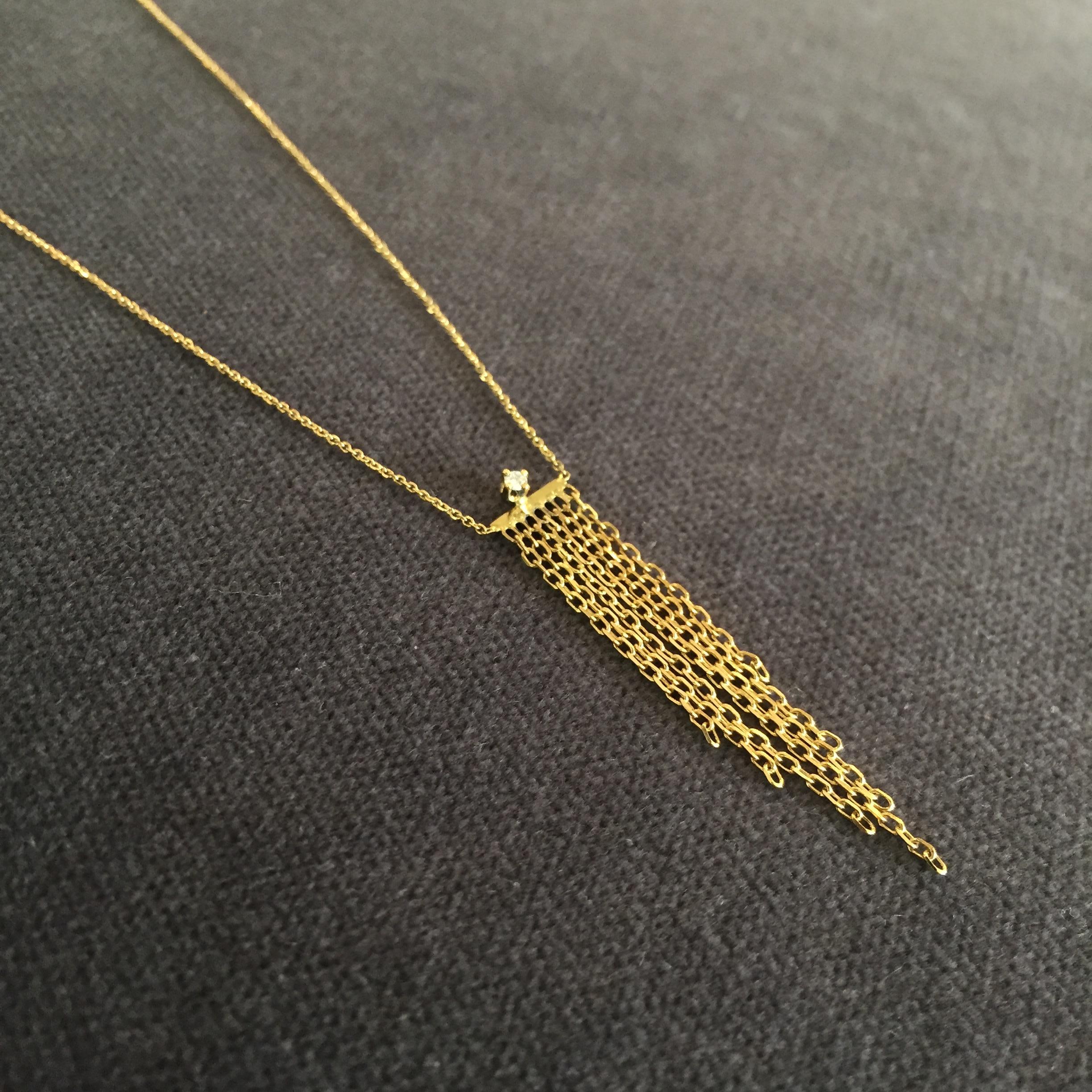 This 18k yellow gold necklace from Sweet Pea's 'Fabulous Fringe' collection has a tapered 35mm long fringe made of diamond-cut chain, topped with a sparkling 0.02ct diamond. The necklace is 38cm long, but can be ordered to any length; please contact