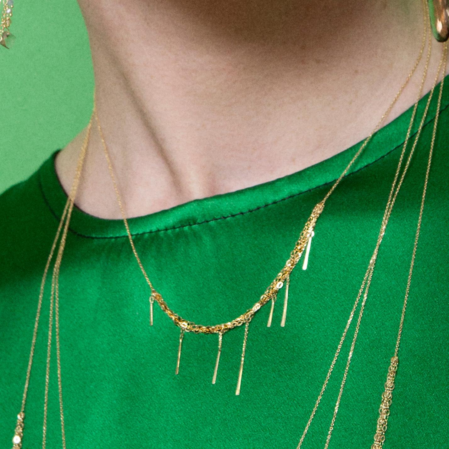 This 18k yellow gold necklace from Sweet Pea's 'Sycamore' collection is a classic.  The length is 40cm but this design can be ordered in different lengths, just get in touch for more details. With a section of layered chains and small hanging bar