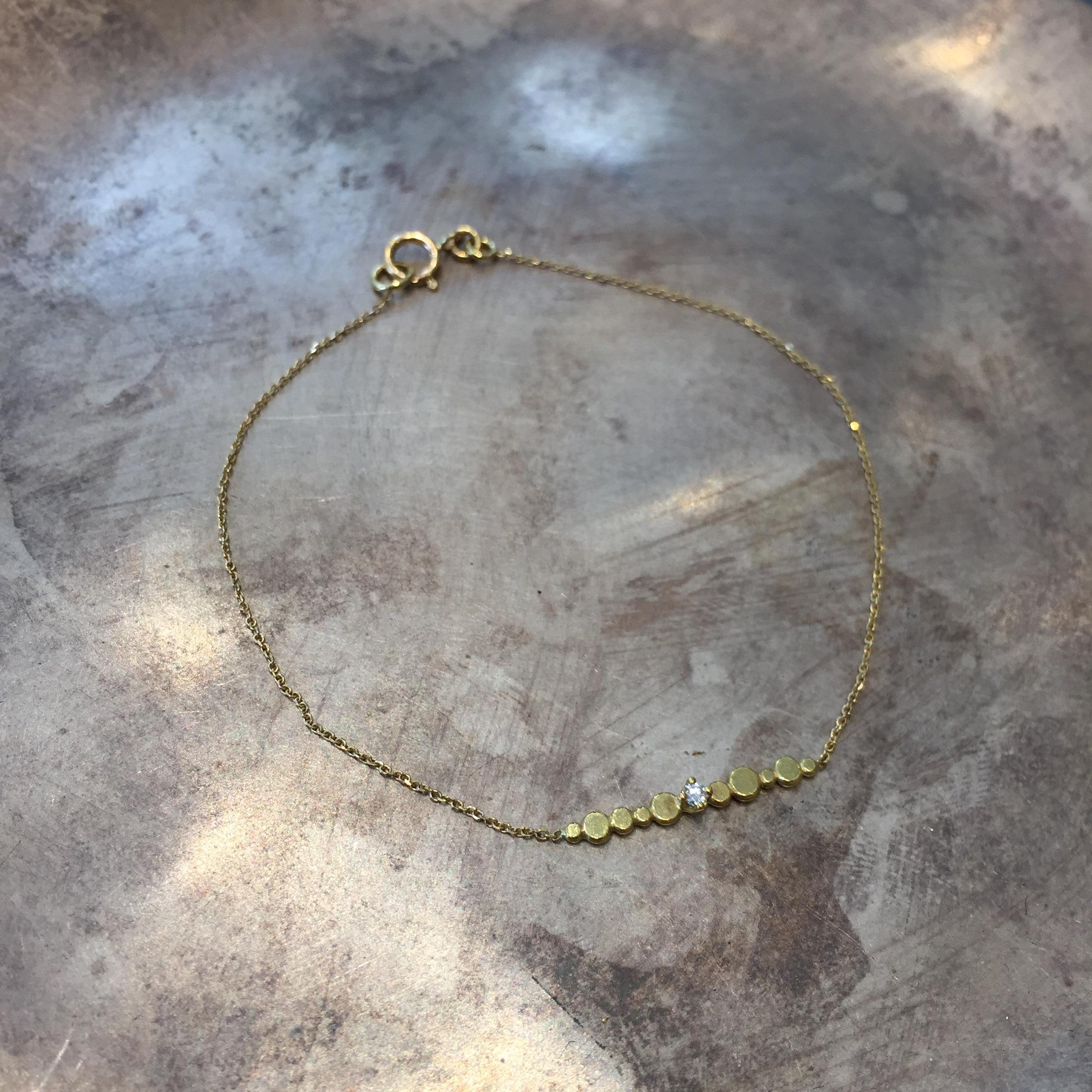 Sweet Pea fine chain bracelet made from 18k yellow gold forms part of our Bits and Bobs collection. The total length of this bracelet is 17cm but it can be ordered in any required size. Set into the length of sparkling gold diamond cut chain, the