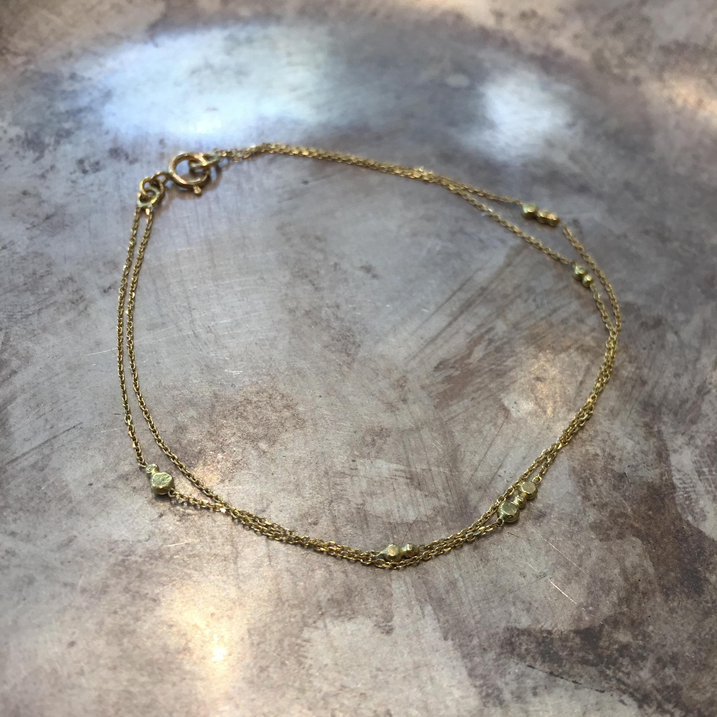 Contemporary Sweet Pea Double Chain 18 Karat Yellow Gold Bracelet For Sale