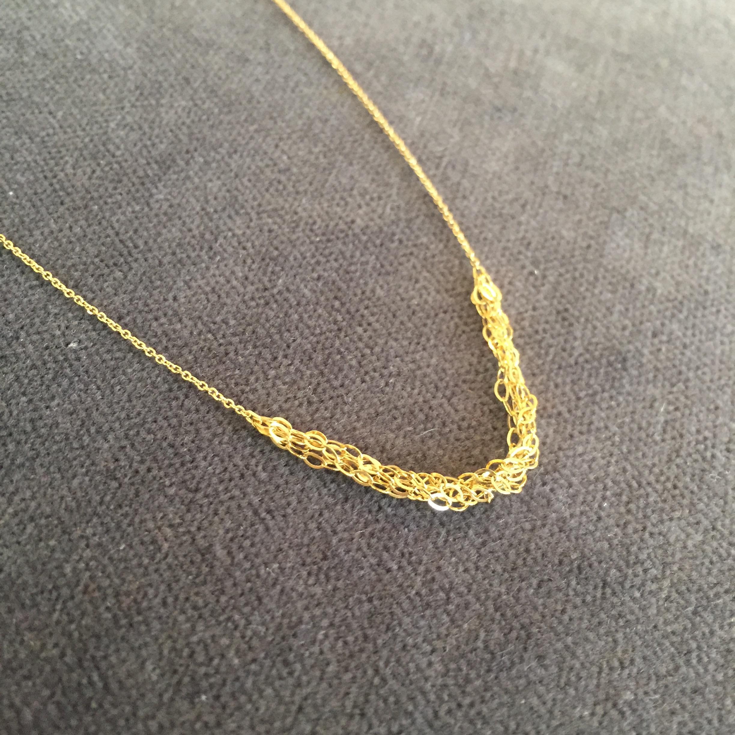This 18k yellow gold necklace is made from delicate fine sparkling chain with a section of layered oval chains at the front. The overall length is 40cm. It makes a perfect everyday necklace and has quickly become a Sweet Pea classic.