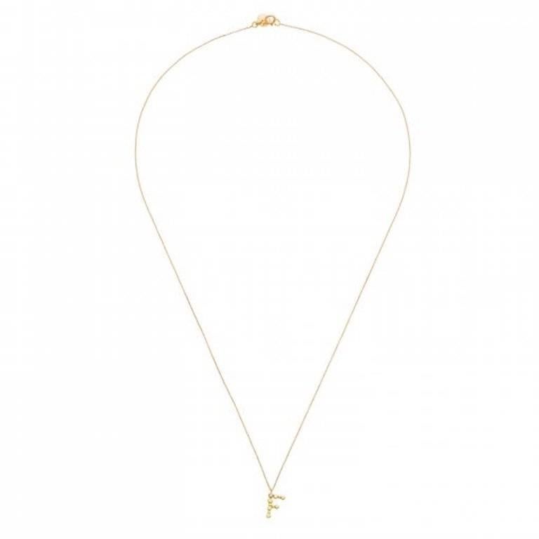 These beautiful charm necklaces are from Sweet Pea's new 'Love Letters' collection, with each letter made from 18k yellow gold and threaded onto a fine chain. The handmade pendant is approximately 10-12mm tall and comprises small gold discs
