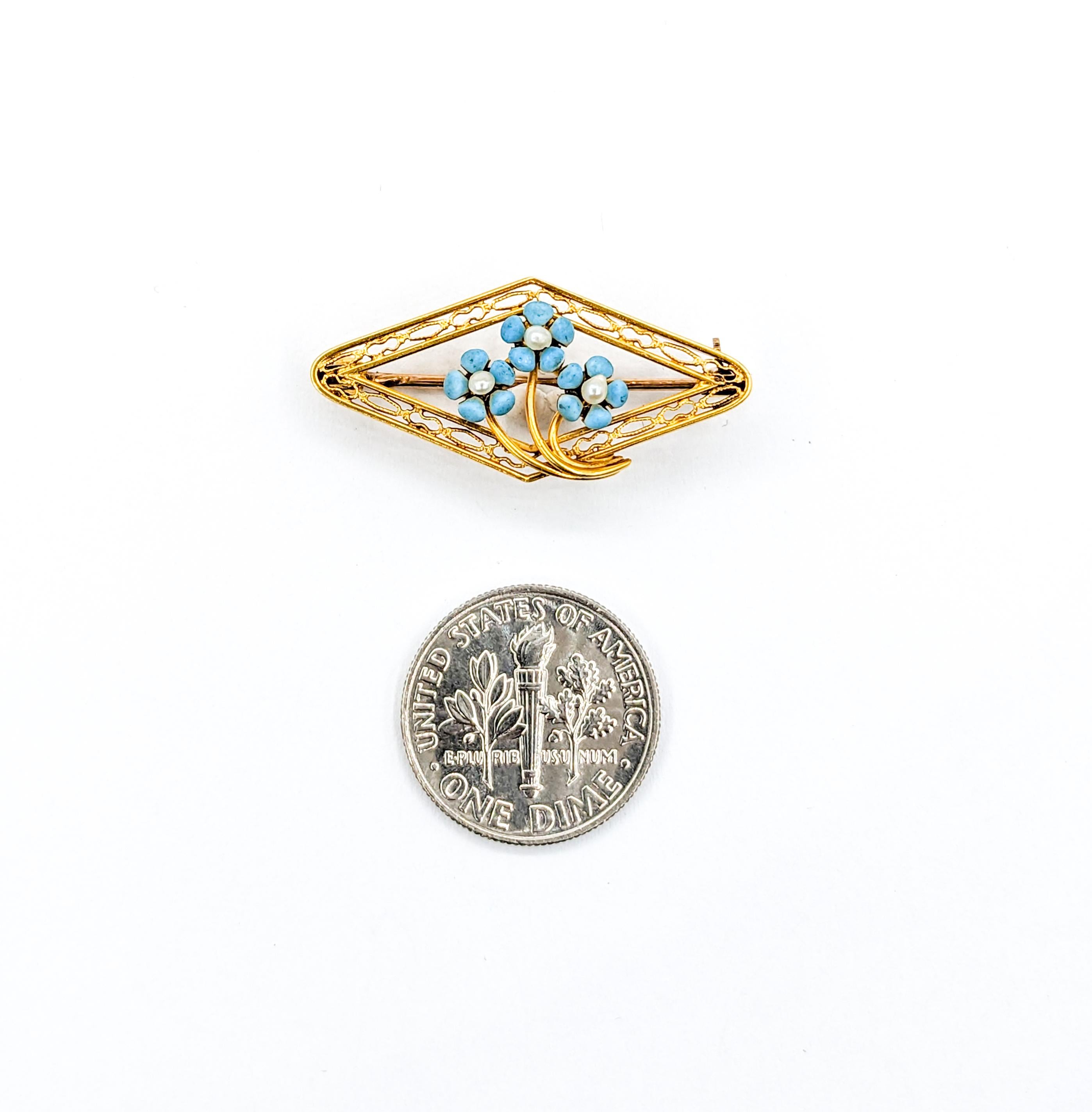 Sweet Turquoise Enamel & Seed Pearl Pin Brooch

Step back in time with our antique floral pin, a piece that encapsulates ageless charm. Skillfully wrought in 10k yellow gold, this brooch is adorned with radiant pearls, shimmering with beautiful