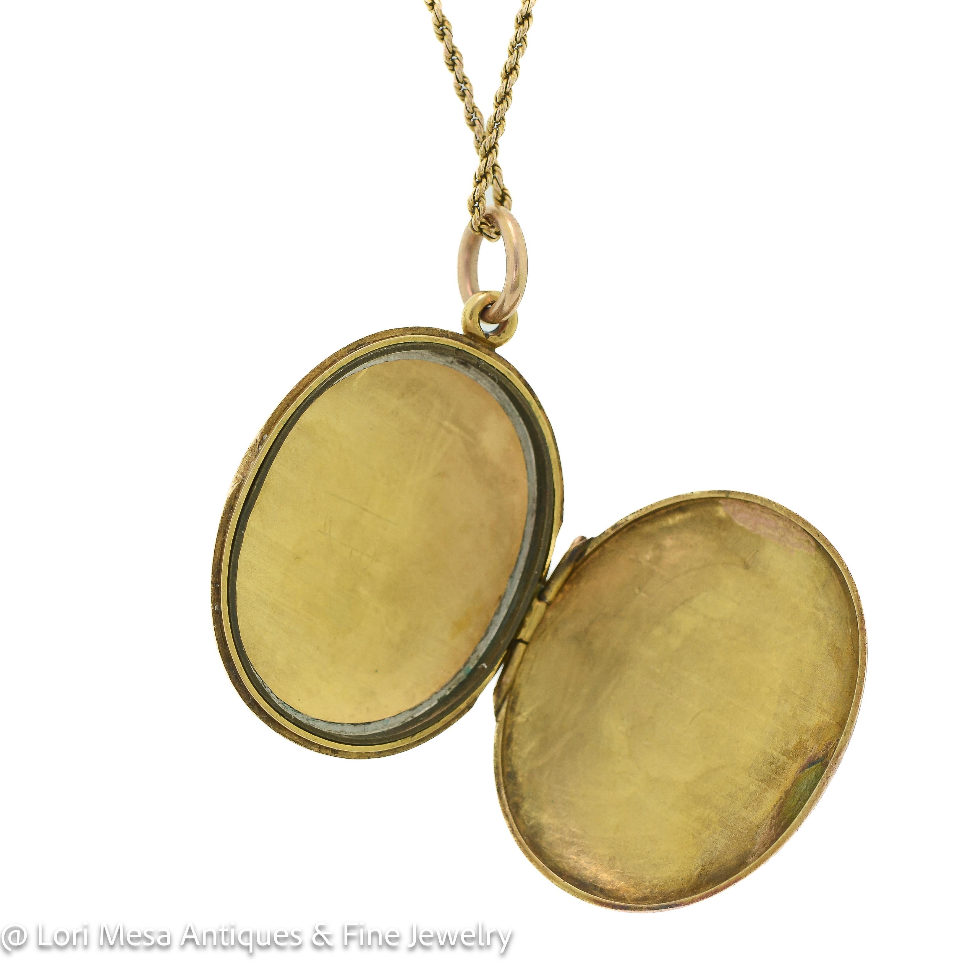 This exquisite Victorian locket is a true masterpiece that dates back to 1870. It is crafted from high-quality yellow gold and has an oval shape that makes it look elegant and stylish. The locket's surface is heavily engraved on both sides,