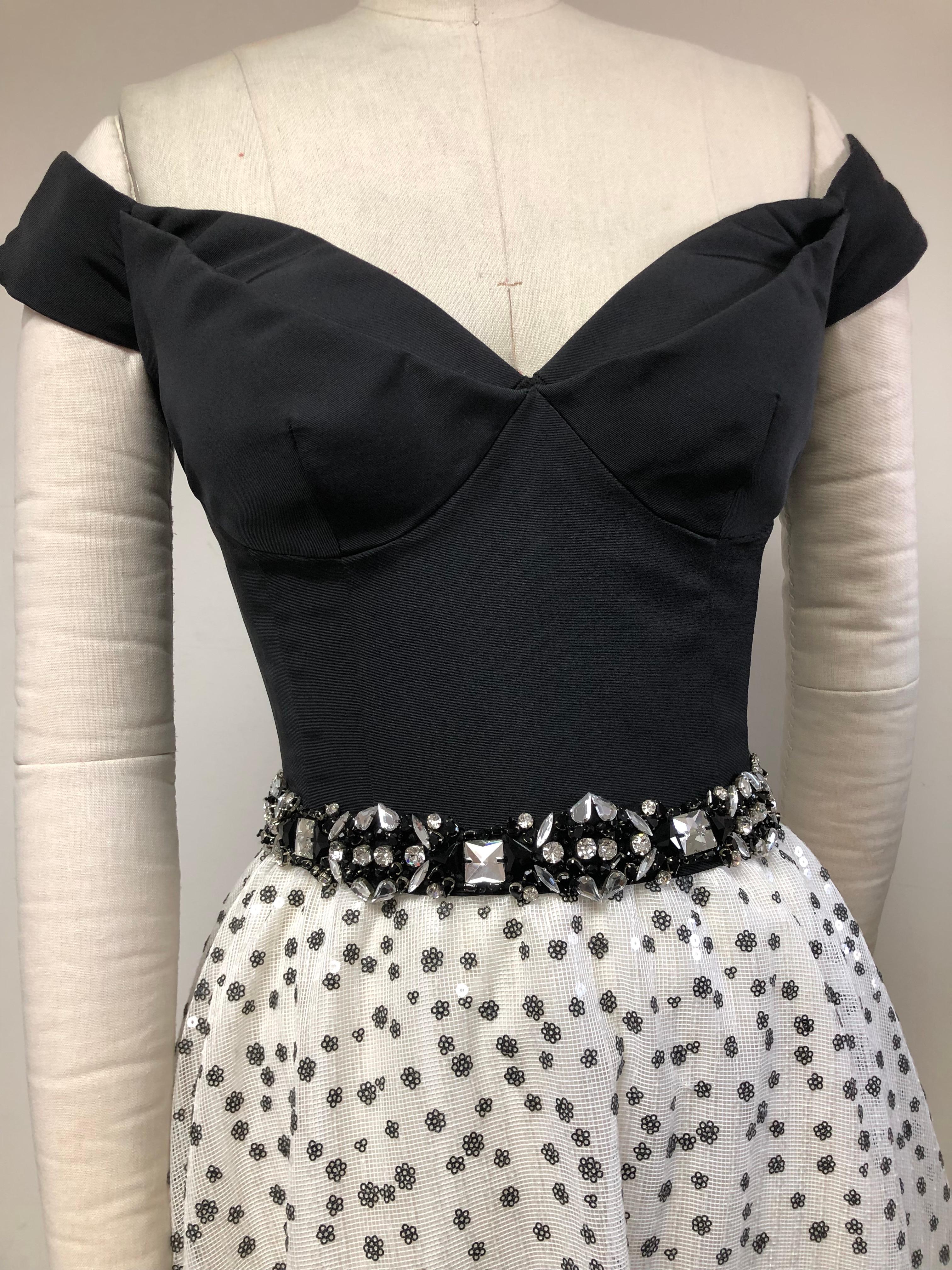 Black and White evening dress ready chic for the party wearing sparkle that never disappoints. 
Black Faille Bustier with Boning and magnificent jeweled belt with a sequined full skirt. This a the only piece of this design  and truly unique. Wedding