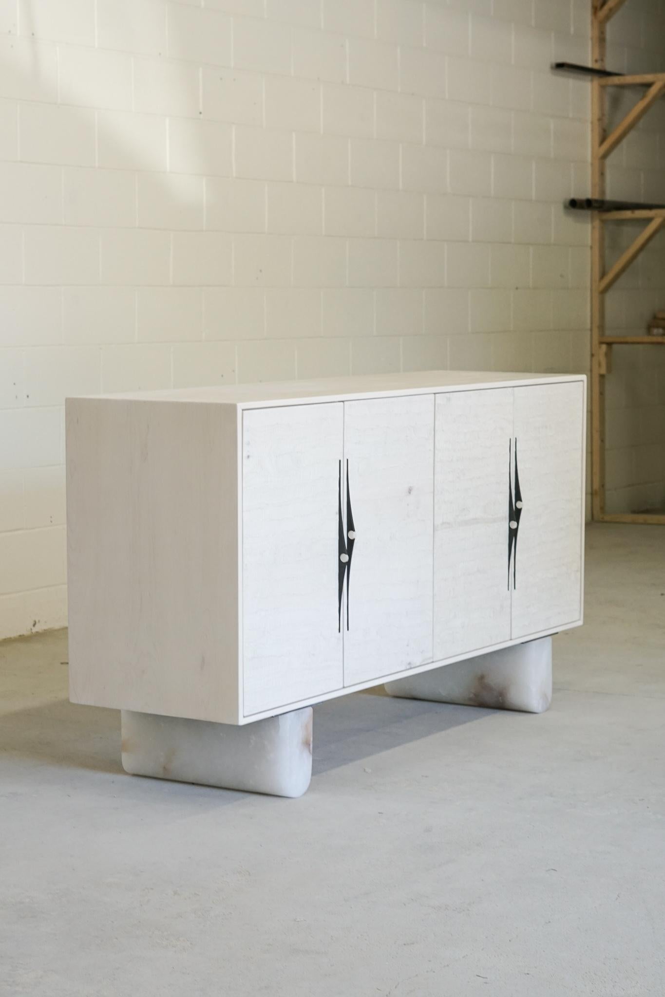 Swell sideboards 72 by Swell Studio
Dimensions: W 183 x D 51 x H 92 cm
Material: Alabaster, bleached maple, blk patina’d brass pulls 
(Available in a variety of wood and stone species)
Also available in different sizes.

This piece is a