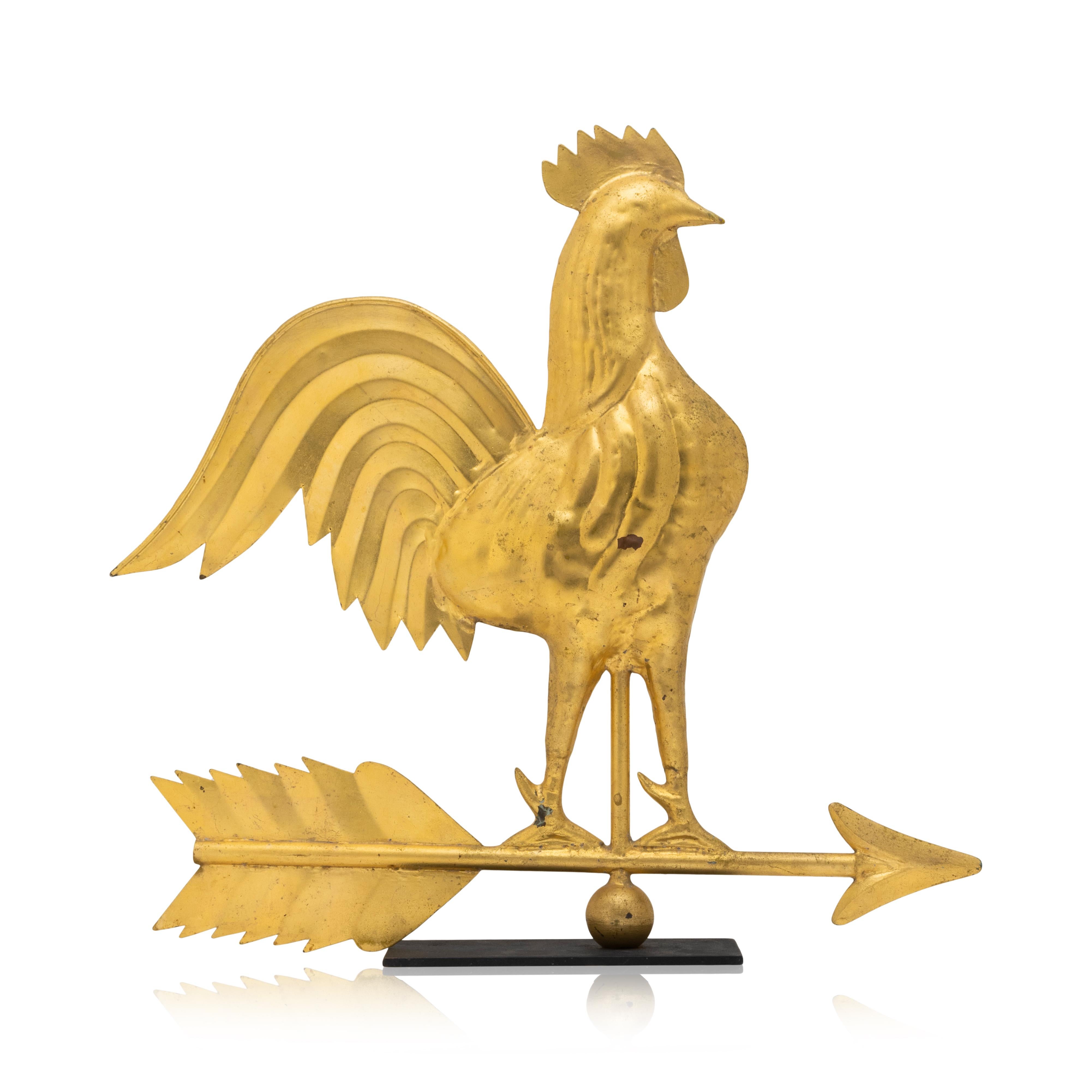 20th Century gilded swell bodied copper rooster weather vane on modern stand. Rooster standing atop a pointed directional. Nice bright copper age on slim black base. 24