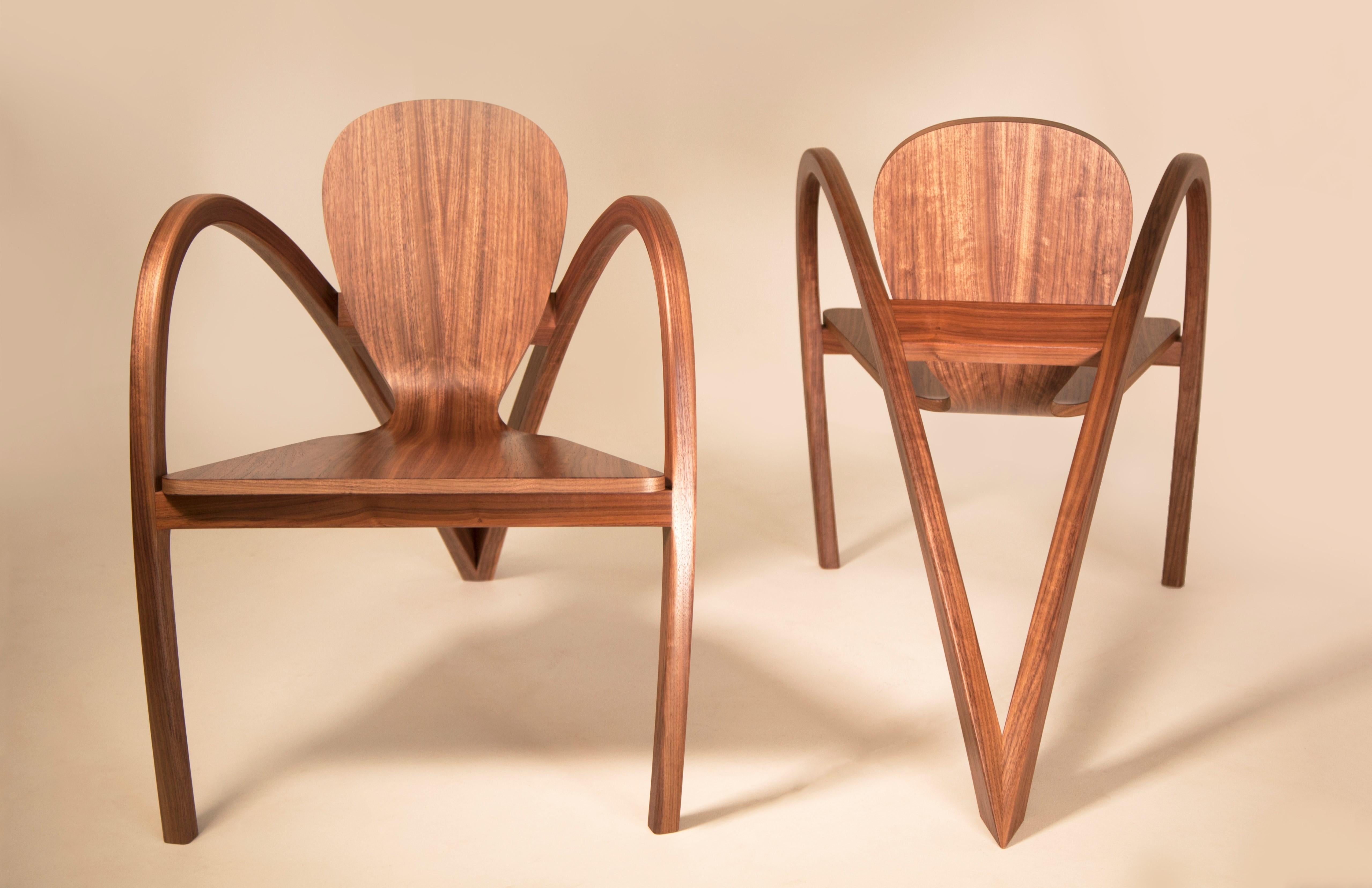 A stunning pair of chairs that pay homage to the iconic shapes and lines of 1930s automobiles. Our chairs are meticulously handcrafted in our Westhampton Beach studio using over 50 layers of consecutive veneers, which are glued together over a mold