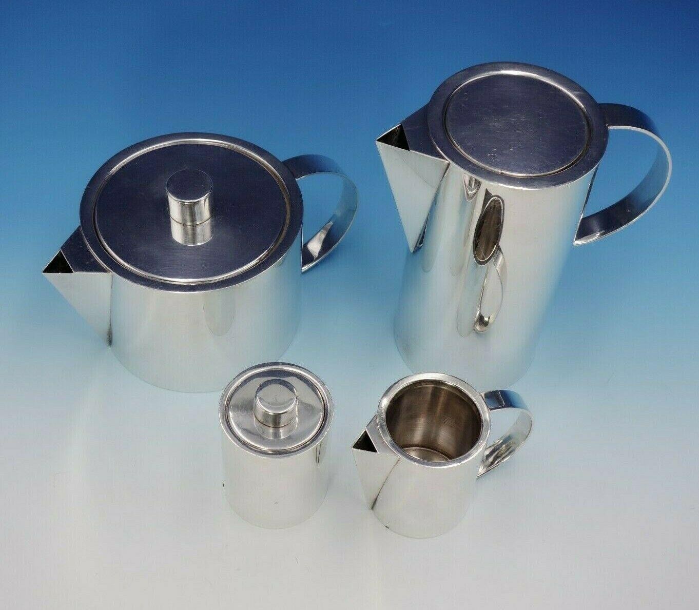 Swid Powell Collection by Guido Galbiati

Exceptional Swid Powell Collection by Guido Galbiati 4-piece sterling silver tea set. This modernist set was made in Milano, Italy, and was retailed at Calvin Klein. This set includes:

1 - Coffee Pot: