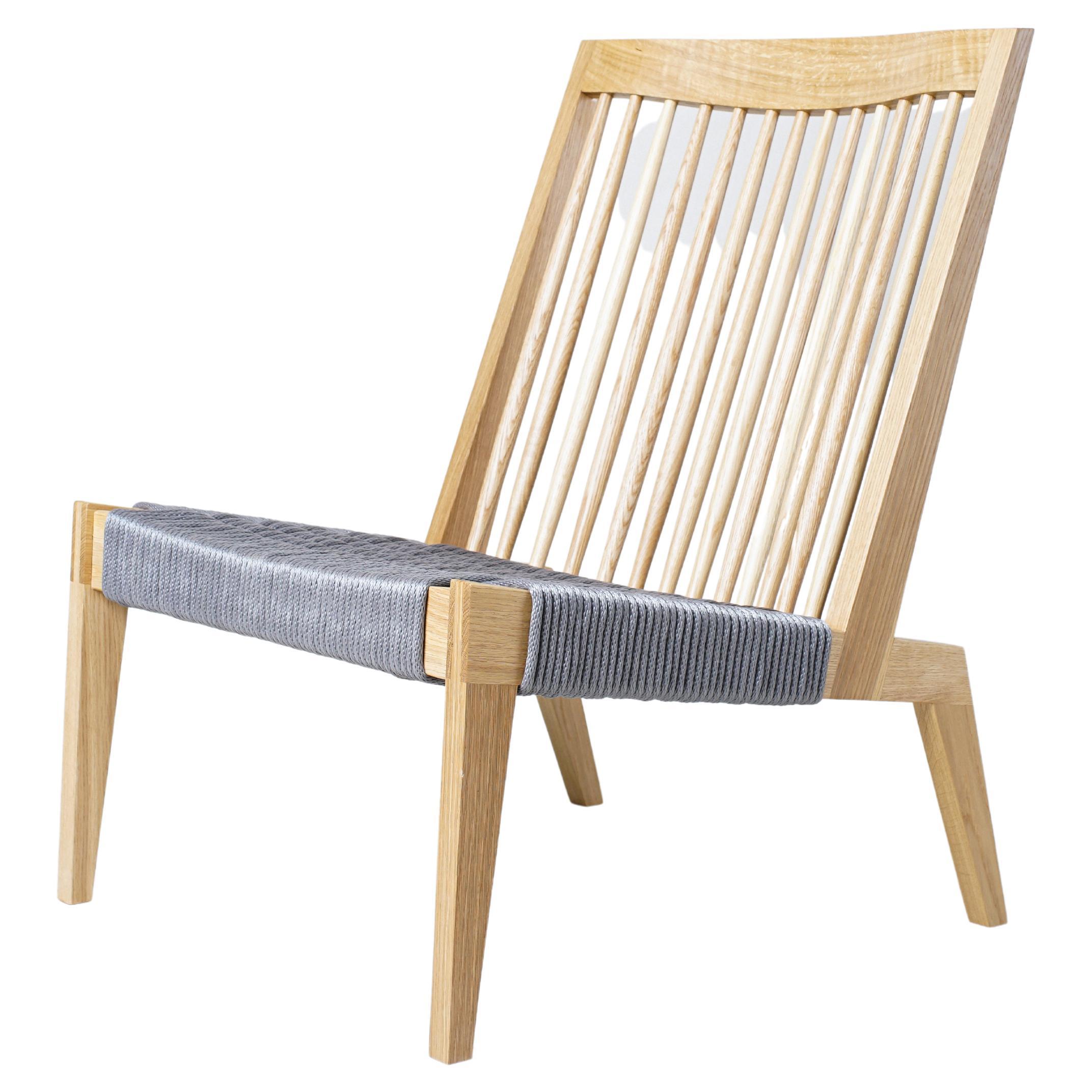 Swift Easy Chair, Moderner Loungesessel mit Spindelrückenlehne aus weißer Eiche und gewebtem Seil