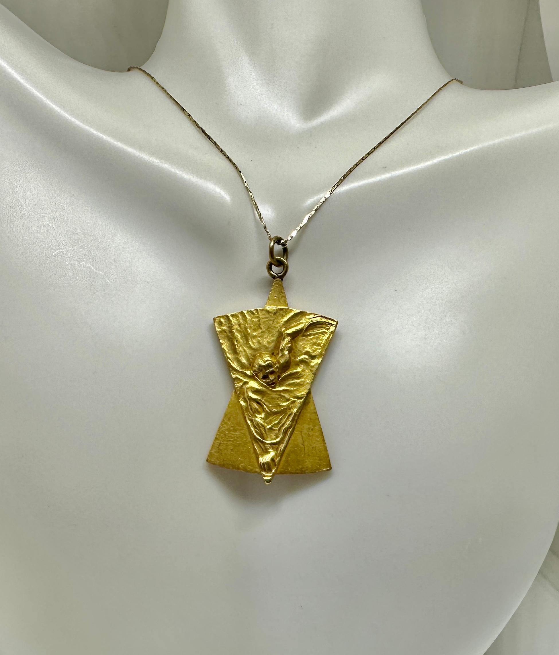 THIS IS A GORGEOUS AND VERY RARE ART NOUVEAU - ART DECO PENDANT DEPICTING A SWIMMER SWIMMING IN THE WATER.  THE MODELING OF THE SWIMMER IN THE WATER IS EXTRAORDINARY AND EXHIBITS STUNNING ART NOUVEAU DESIGN.  I BELIEVE THIS IS A SWIMMING MEDAL.  IT