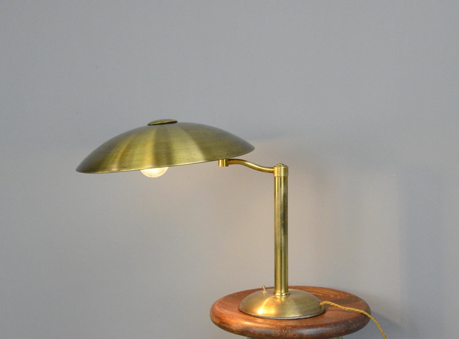 Swing arm brass table lamp by Hillebrand circa 1930s

- Solid brass
- On/Off toggle switch on the base
- Takes E27 fitting bulbs
- Swing out arm
- Designed by Egon Hillebrand and stamped with his initials on the cast iron base
- Produced by