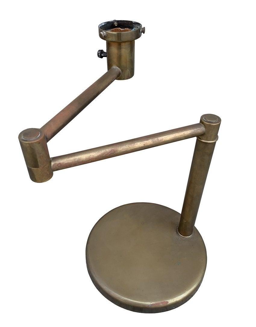 1970's Walter Von Nessen swing arm table lamp in brass finish.
This lamp is a real beauty, the adjustable arm is very helpful when reading and it works great as an accent light as well.
The lamp is in excellent original condition with great aged