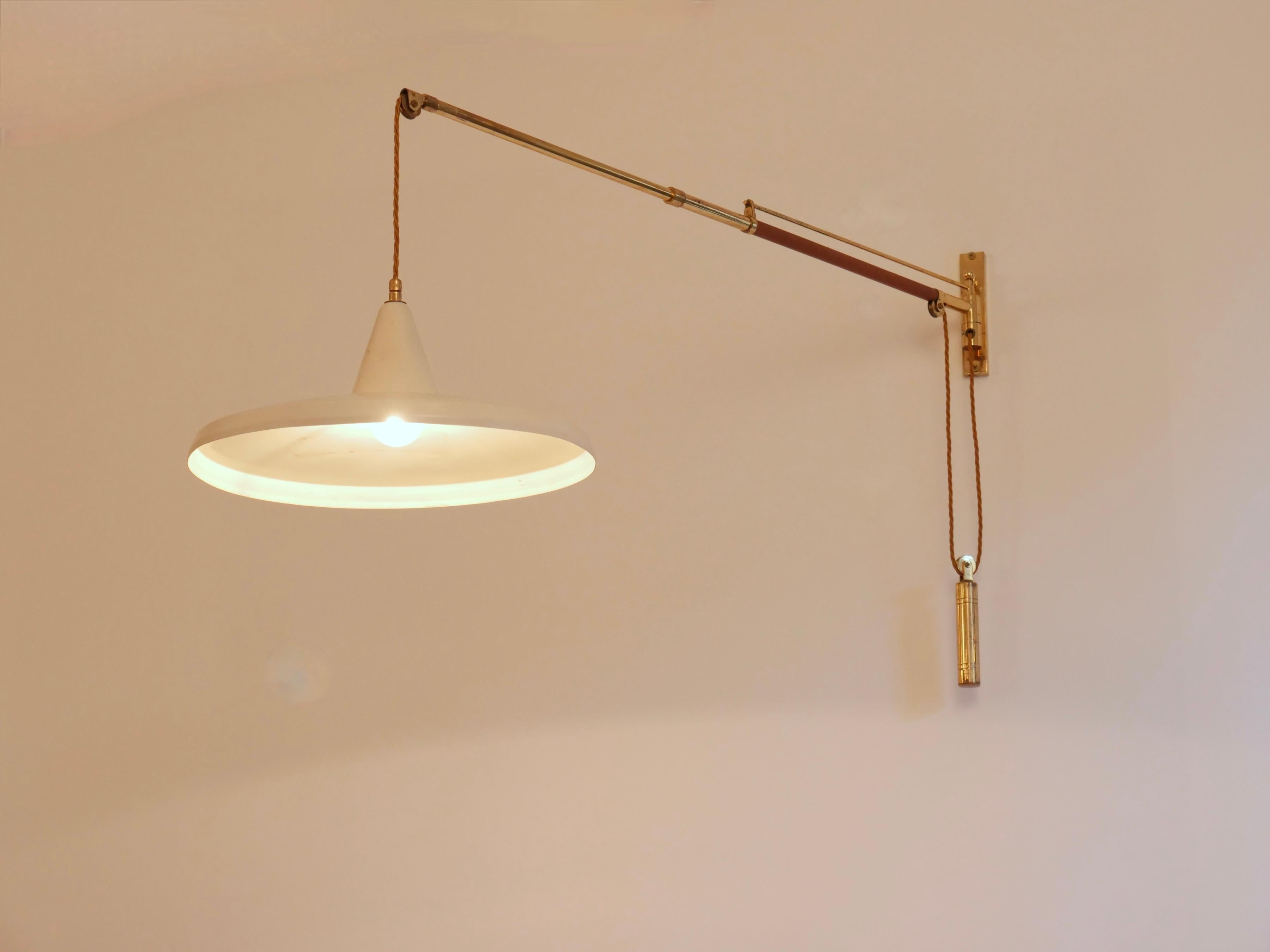 Mid-Century Modern Swing arm wall light. Brass and leather Italy c1950 Brass n For Sale