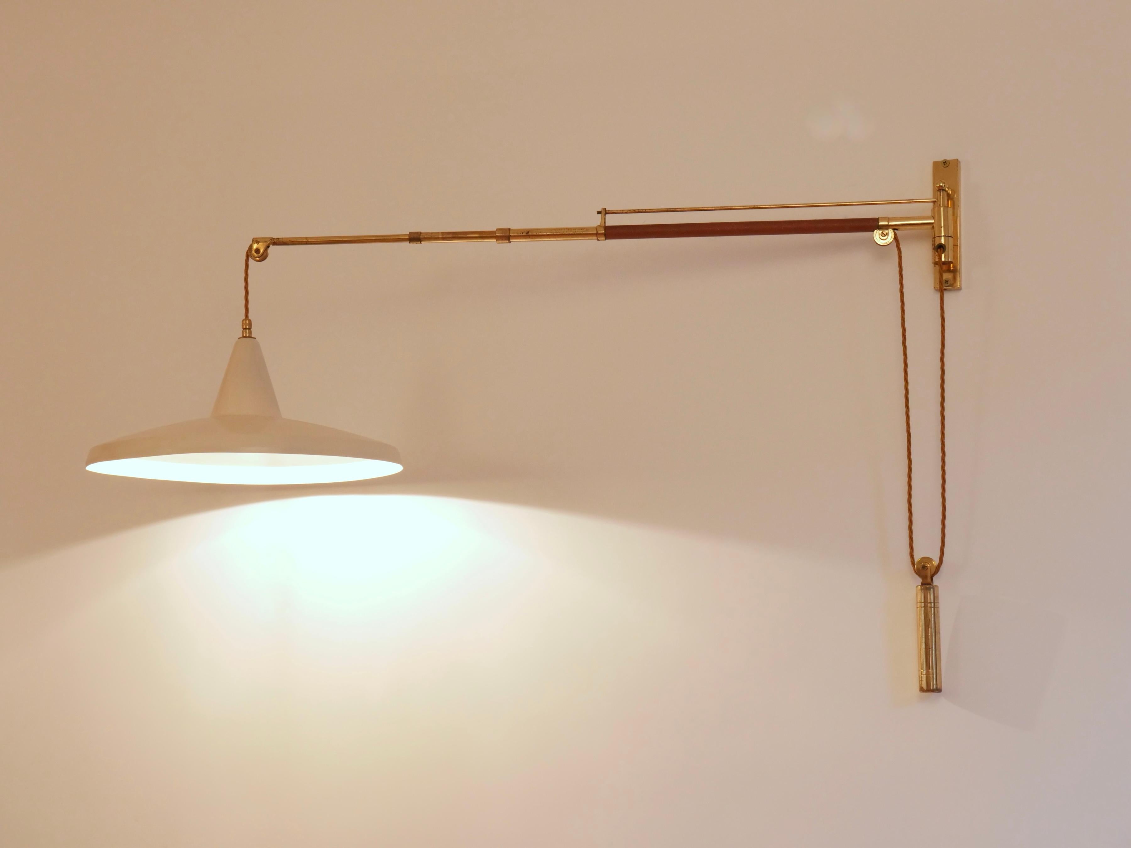 Italian Swing arm wall light. Brass and leather Italy c1950 Brass n For Sale