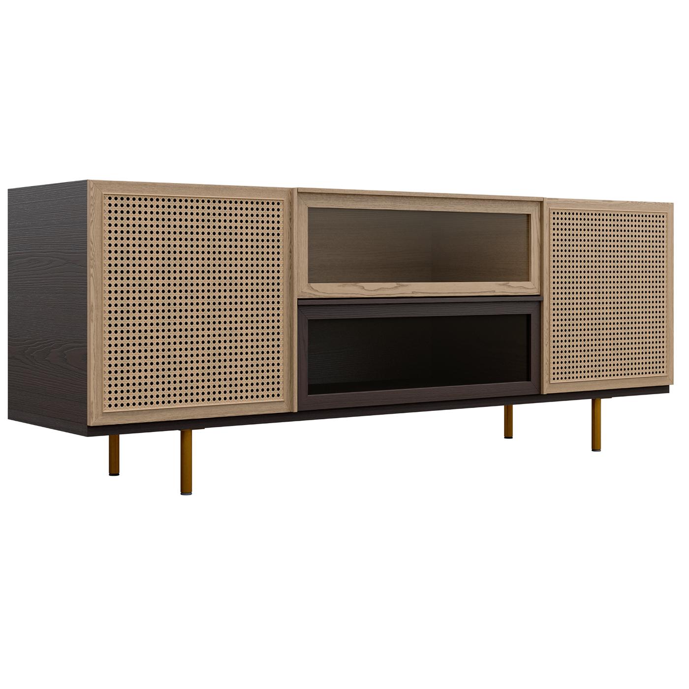 This sideboard features two swinging doors with Vienna straw panels and two central glass-fronted drawers. Inside, there are two adjustable glass shelves providing versatile storage. Elevated on brass legs, this piece blends natural textures with