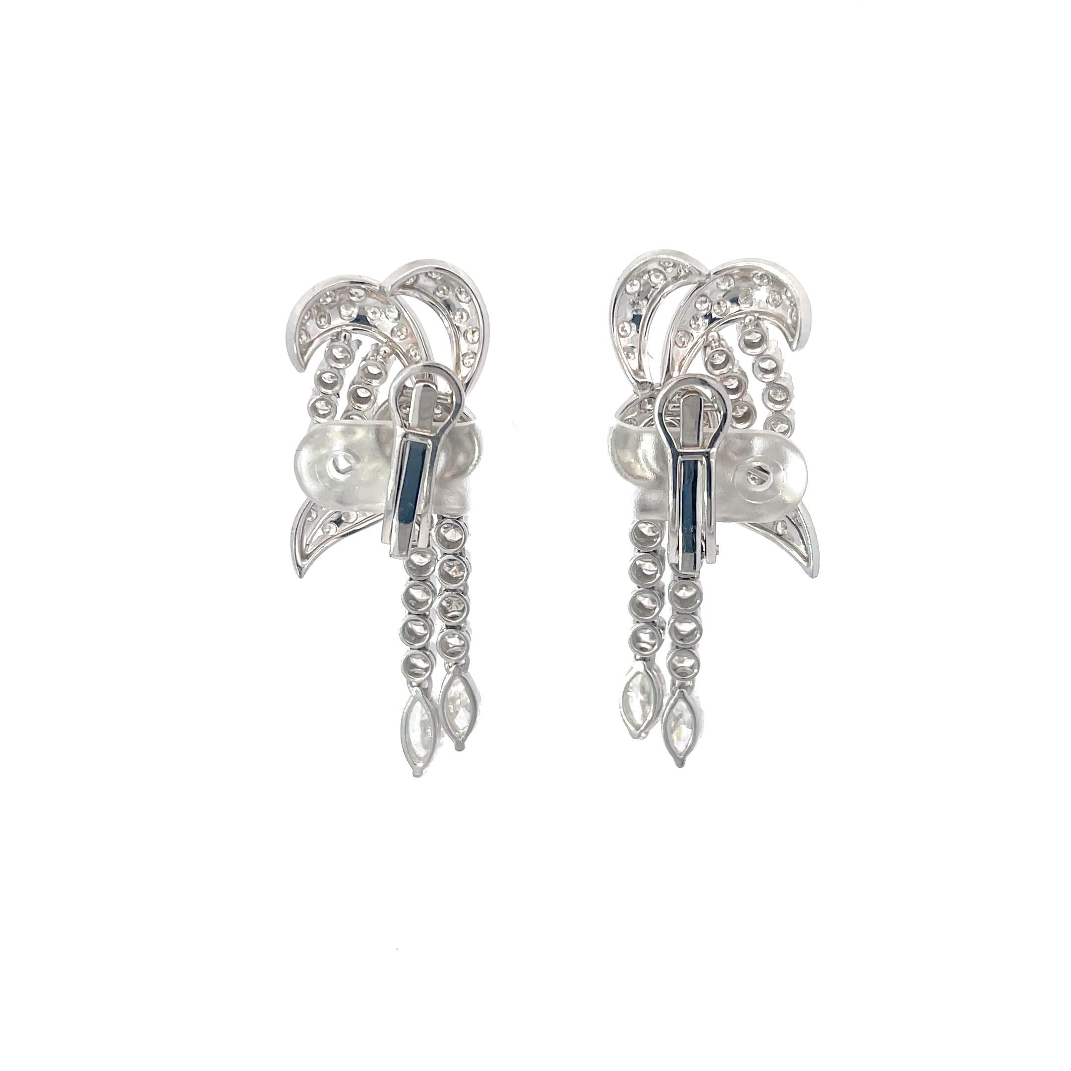 Swirl 6.25ctw Diamond Earrings in Platinum. The earrings feature 6.25ctw of round and marquise cut diamonds. 
2