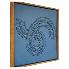 Remolino. Una pieza de Arte Escultórico 3D de Cuero Azul para la Pared