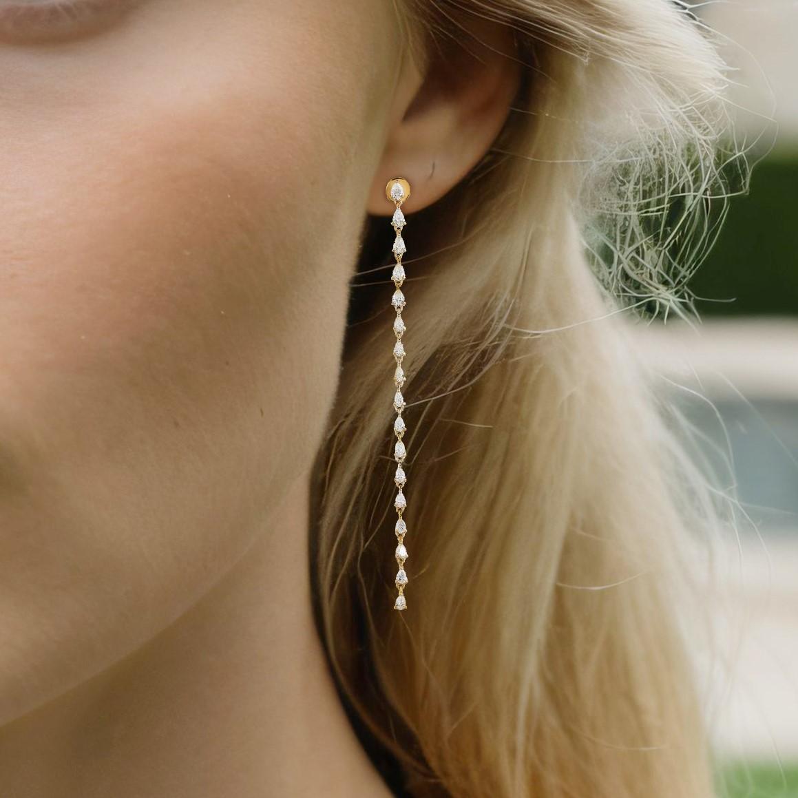 The Swirl Diamond 14K Yellow Gold Drop Earrings are a masterpiece of elegance, crafted in a stunning combination of 14K yellow and white gold. Featuring natural diamonds with a total carat weight of 1.8CT and a lightweight 3GR design, these earrings