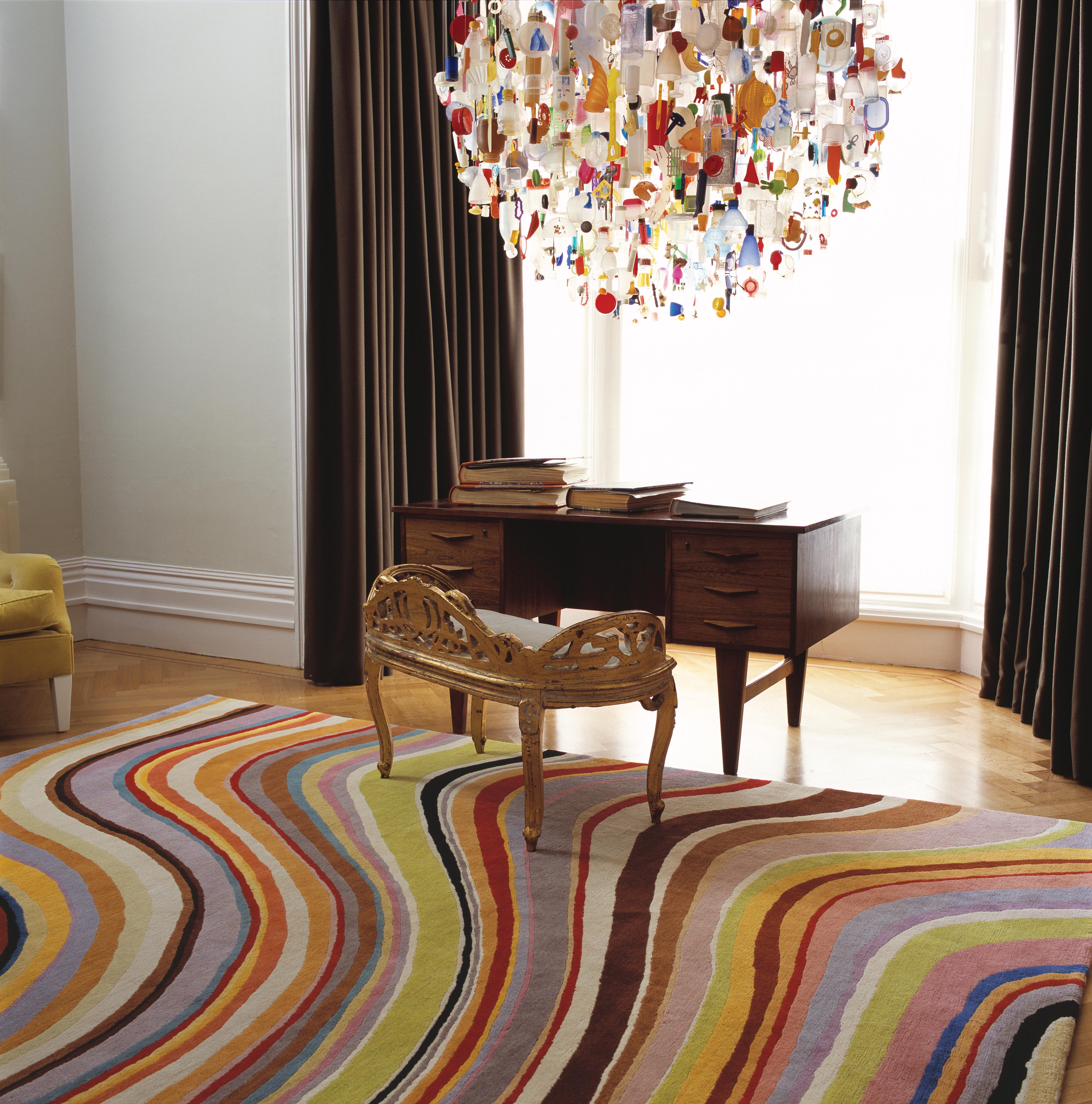 Paul Smith's signature Swirl is instantly recognizable as a work of graphic genius. In washed-out, muted tones of pale olive, ginger, grey and cream, this hand-knotted rug in pure Tibetan wool is an ultimate expression of this iconic