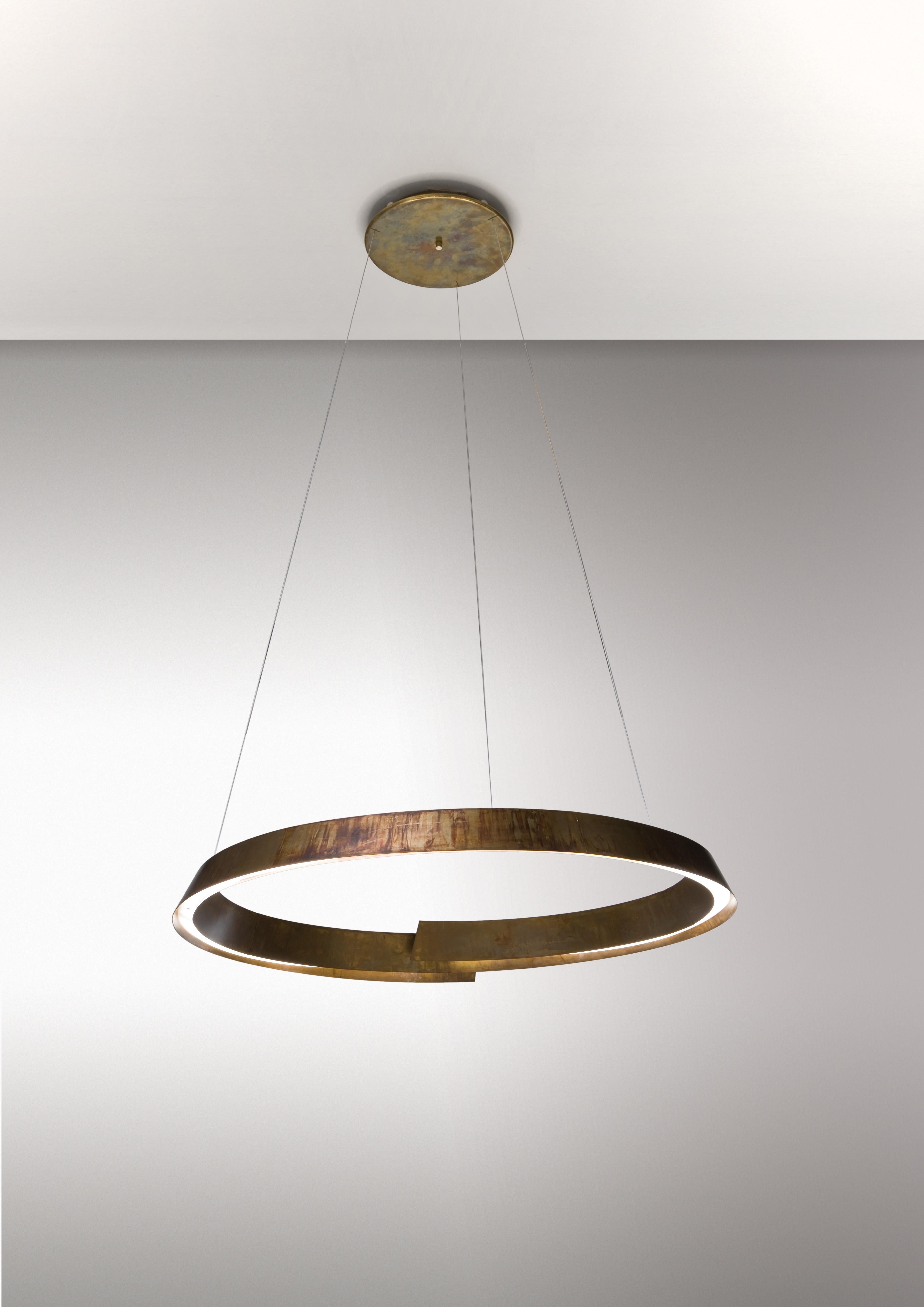 Swirl Lamp by Laurameroni
Dimensions: W 100 x D 100 x H 200 cm
Materials: Acid‐etched brass. 

Suspension LED lamp with steel cables, made of a thin spiral acid‐etched brass metal strip.

Laurameroni:
The ability of craftsmen from the Brianza area