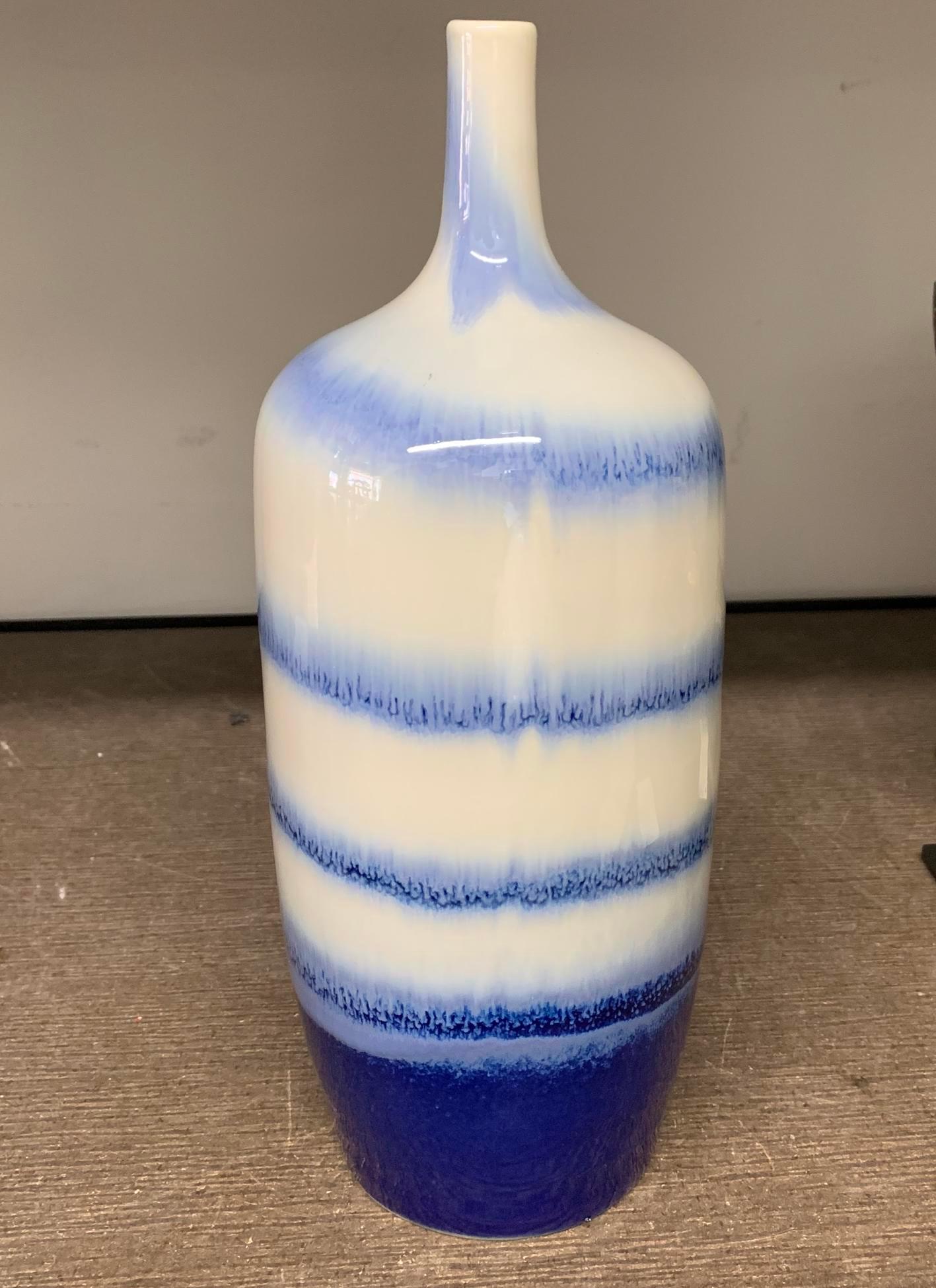 Contemporary Chinese shades of blue and white swirl pattern thin neck vase.
 
