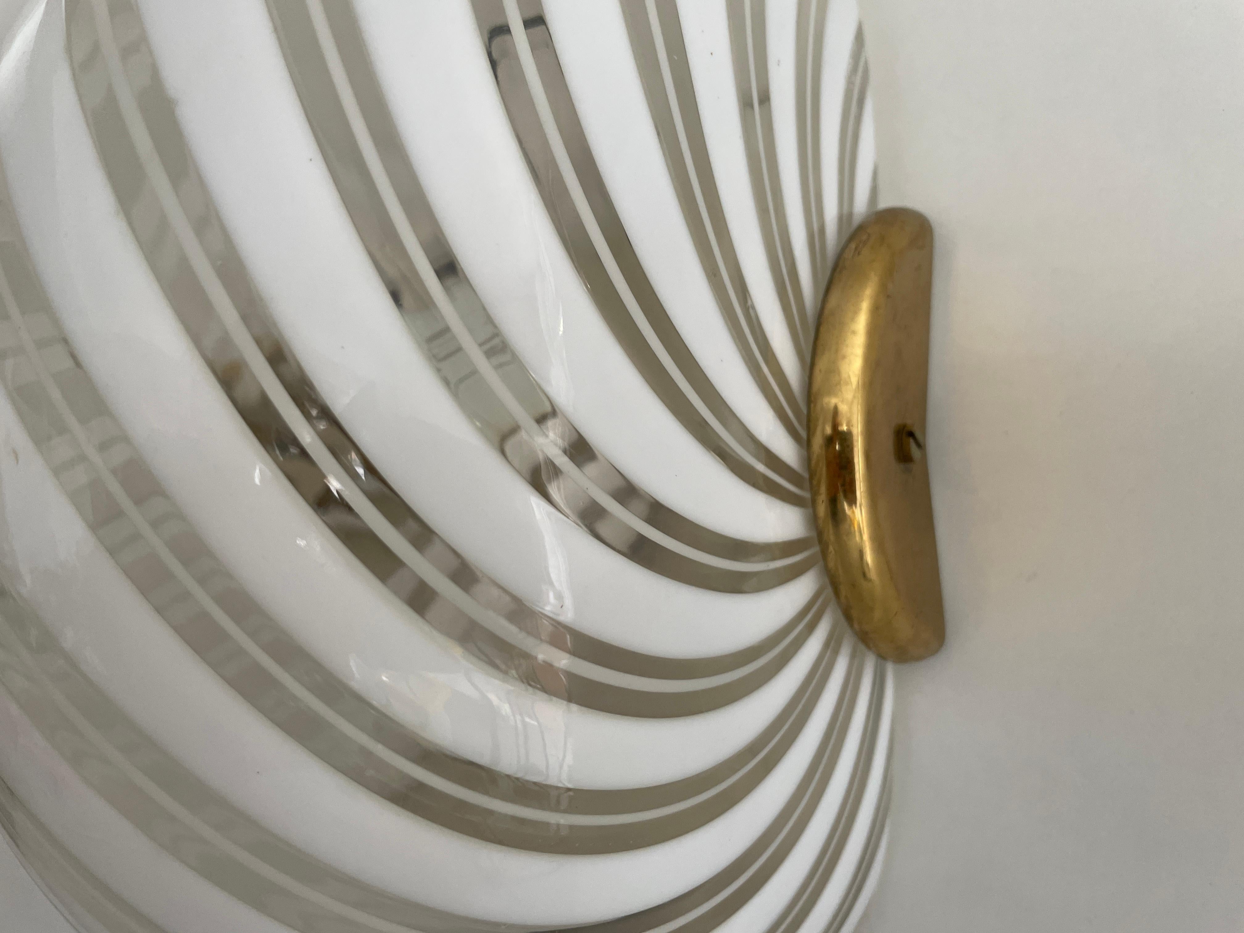 Metallo Coppia di appliques in vetro di Murano con motivo a vortice di F. Fabbian, anni '70, Italia in vendita
