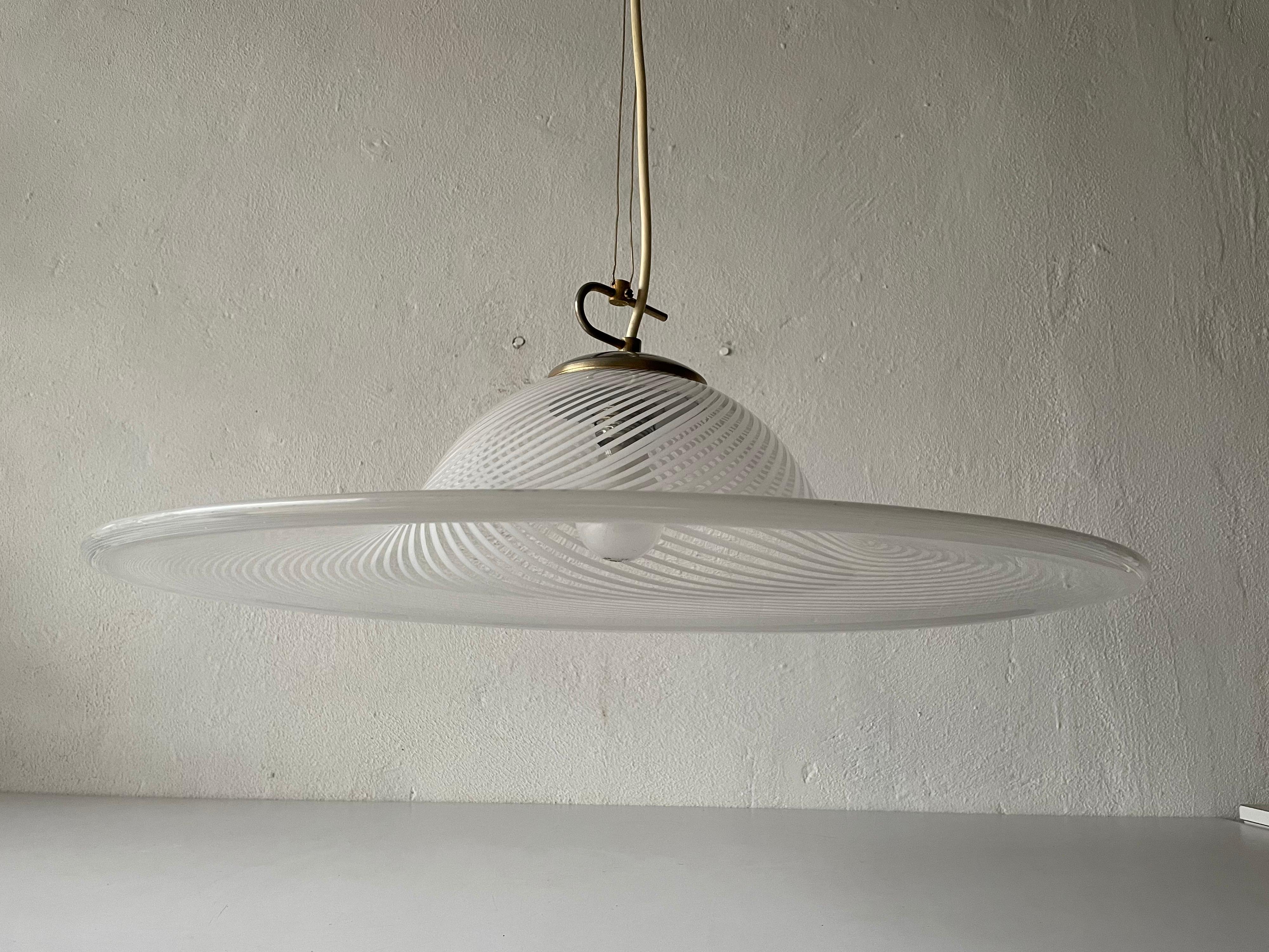 Swirl Printed glass large pendant lamp by Vetri Murano, 1970s, Italy

Elegant and minimal design hanging lamp

Lampshade is in good condition and very clean. 
This lamp works with E27 light bulb. Max 100W
Wired and suitable to use with 220V