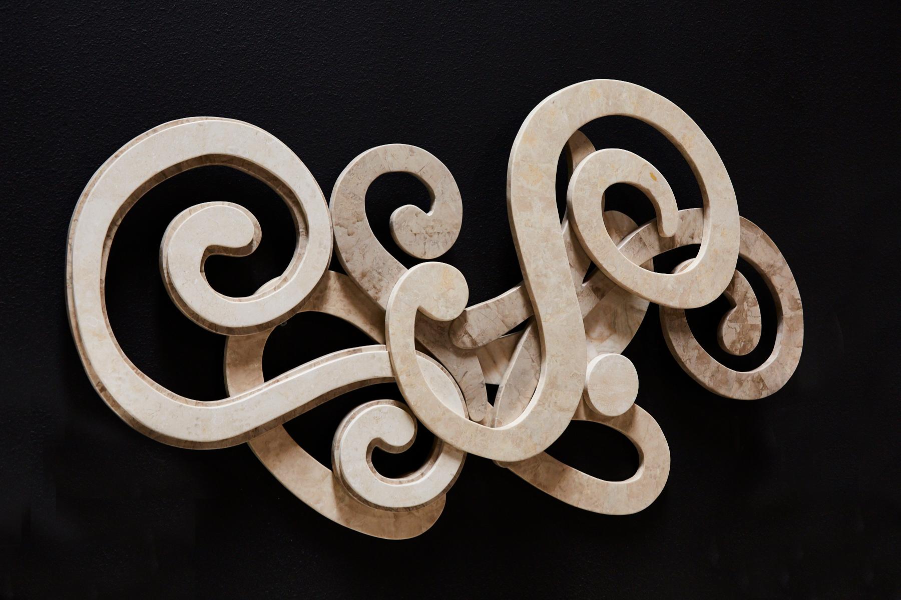 Swirled abstract wall sculpture executed in handcut and inlaid tessellated stone, including Cantor stone, Beige Fossil stone and Woodstone for a neutral color palette.

All furnishings are made from 100% natural Fossil Stone or Seashell inlay,