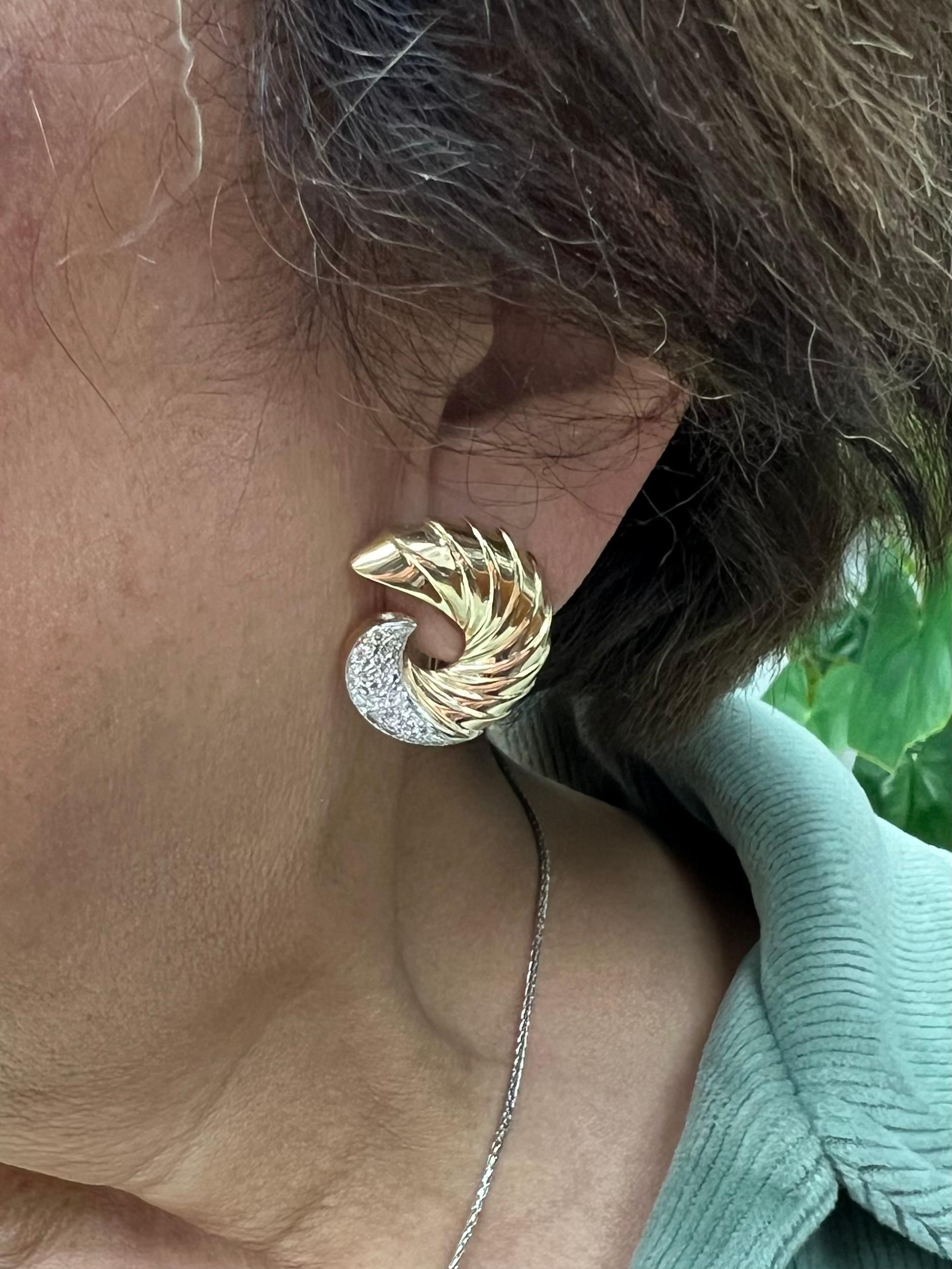 Swirl yellow gold and diamond clip and post earrings from the 1990s.

The 1990s marked a significant era for fashion, particularly in the realm of jewelry, where unique designs and materials became prevalent. Among these trends were the swirl yellow