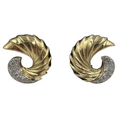 Orecchini a clip e a perno con diamanti in oro giallo Swirl
