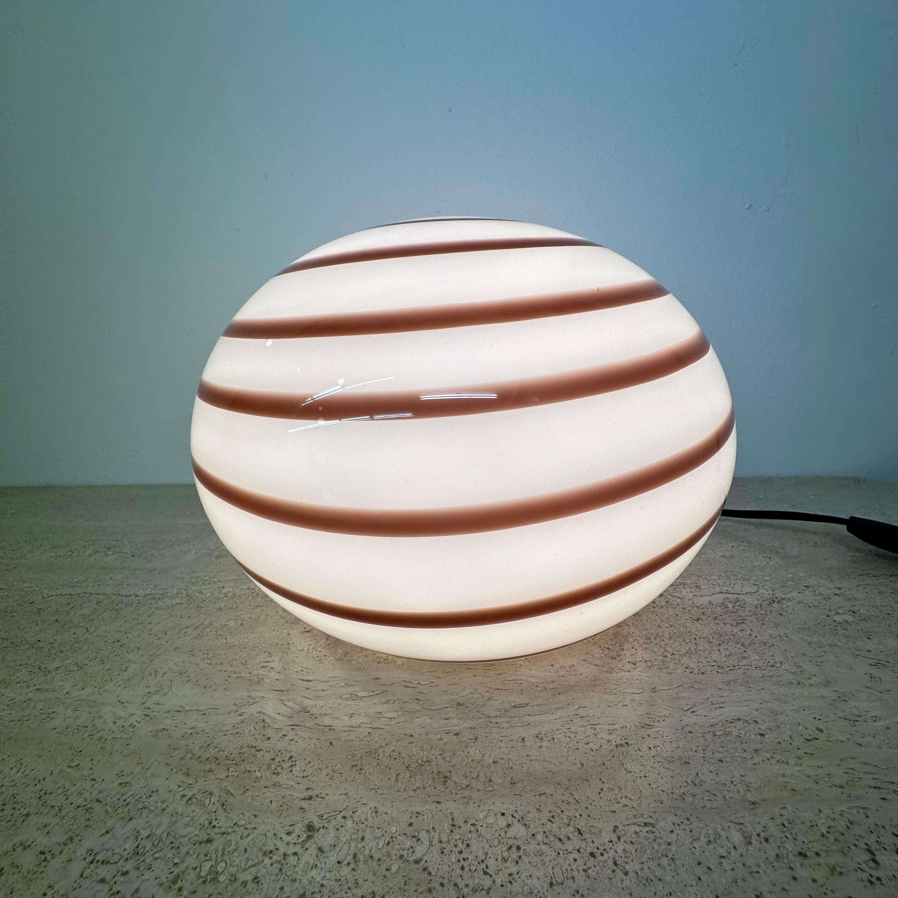 Swirl Zebra table lamp murano glass , 1970’s
Dimensions: 24 cm diameter, 19 cm Height
Color: White , brown
Material: Glass
Period: 1970’s