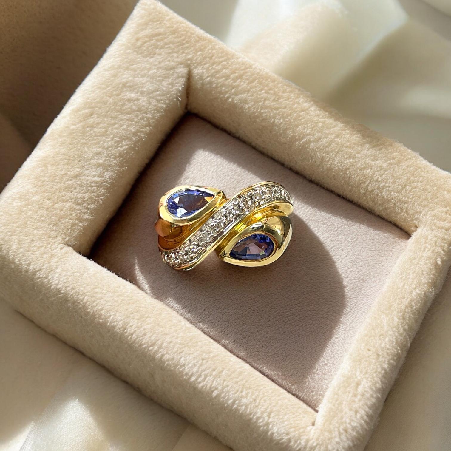 Art Deco Swirling Beauty: 14K Yellow Gold Pear-Shaped Tanzanite and Diamond Ring For Sale