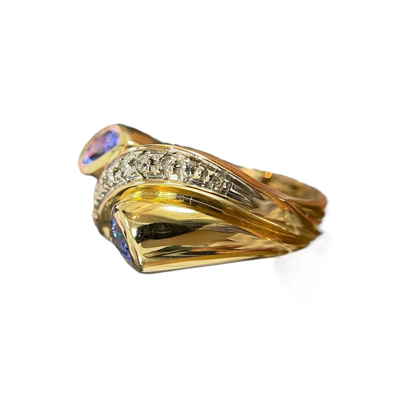 Swirling Beauty: 14K Yellow Gold Pear-Shaped Tanzanite and Diamond Ring In Excellent Condition For Sale In New York, NY