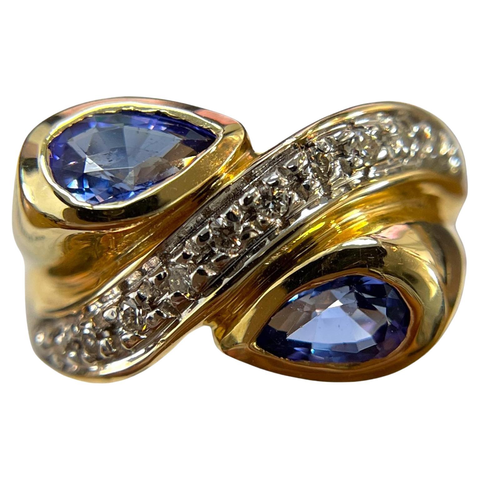 Swirling Beauty: 14K Yellow Gold Pear-Shaped Tanzanite and Diamond Ring For Sale